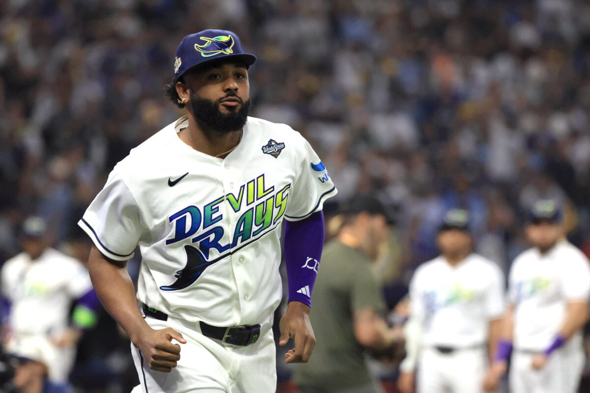 Oct 26, 2026; St. Petersburg, Florida, USA;  Tampa Bay Rays infielder Junior Caminero (13) runs on the field during player introductions before game three of the 2026 World Series against the Milwaukee Brewers at Tropicana Field.  Mandatory Credit: Kim Klement Neitzel-Imagn Images