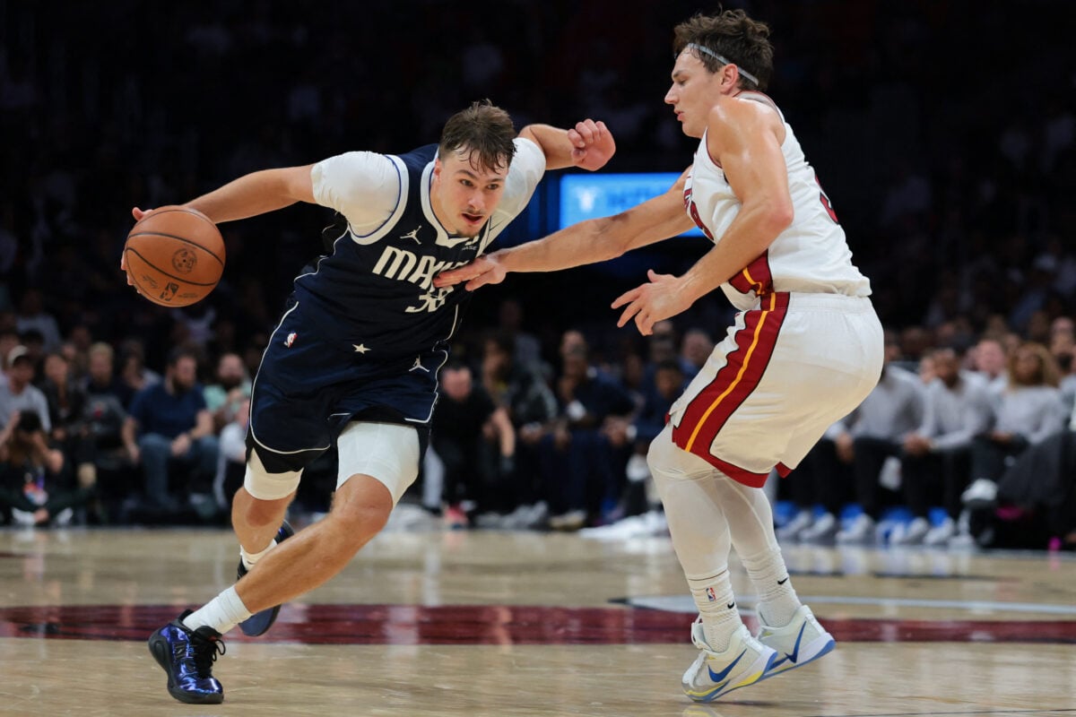 Oct 26, 2026; Miami, Florida, USA; Dallas Mavericks forward Cooper Flagg (32) drives to the basket against Miami Heat guard Pelle Larsson (9) during the fourth quarter at Kaseya Center. Mandatory Credit: Sam Navarro-Imagn Images