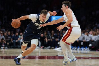Oct 26, 2026; Miami, Florida, USA; Dallas Mavericks forward Cooper Flagg (32) drives to the basket against Miami Heat guard Pelle Larsson (9) during the fourth quarter at Kaseya Center. Mandatory Credit: Sam Navarro-Imagn Images