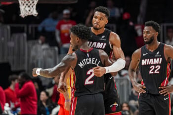 Oct 28, 2026; Atlanta, Georgia, USA; Miami Heat forward Giannis Antetokounmpo (7) and guard Davion Mitchell (2) react at the end of the game against the Atlanta Hawks at State Farm Arena. Mandatory Credit: Dale Zanine-Imagn Images