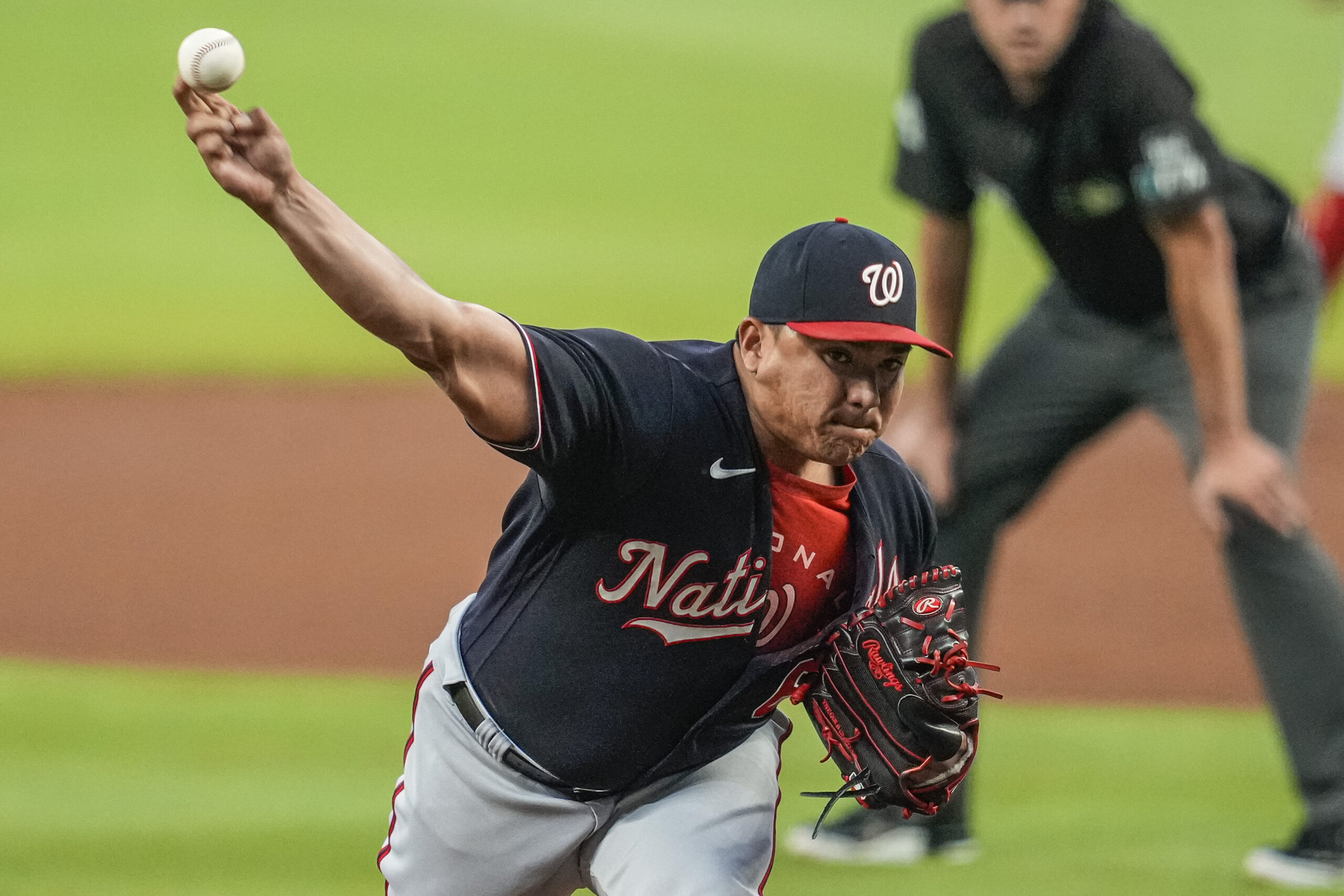 Sep 20, 2022; Cumberland, Georgia, USA; Washington Nationals Washington Nationals relief pitcher Erasmo Ramirez (61) pitches against the Atlanta Braves during the first inning at Truist Park. Mandatory Credit: Dale Zanine-Imagn Images