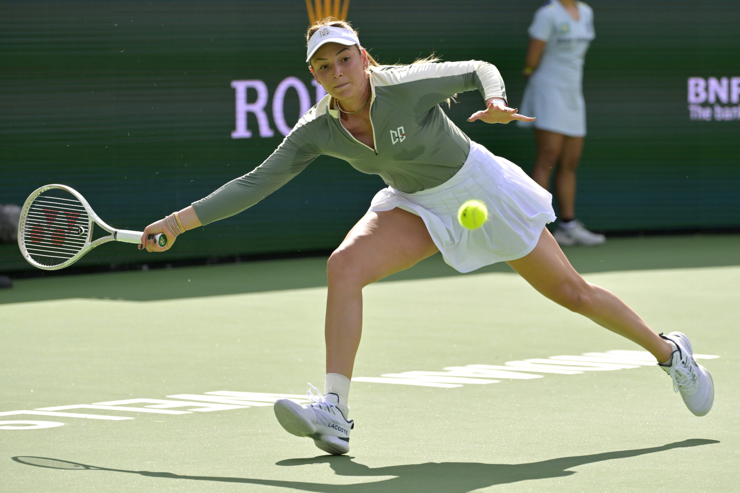 Mar 12, 2025; Indian Wells, CA, USA;  Donna Vekic (CRO) hits a shot against Madison Keys (not pictured) in round four of the BNP Paribas Open at the Indian Well Tennis Garden. Mandatory Credit: Jayne Kamin-Oncea-Imagn Images