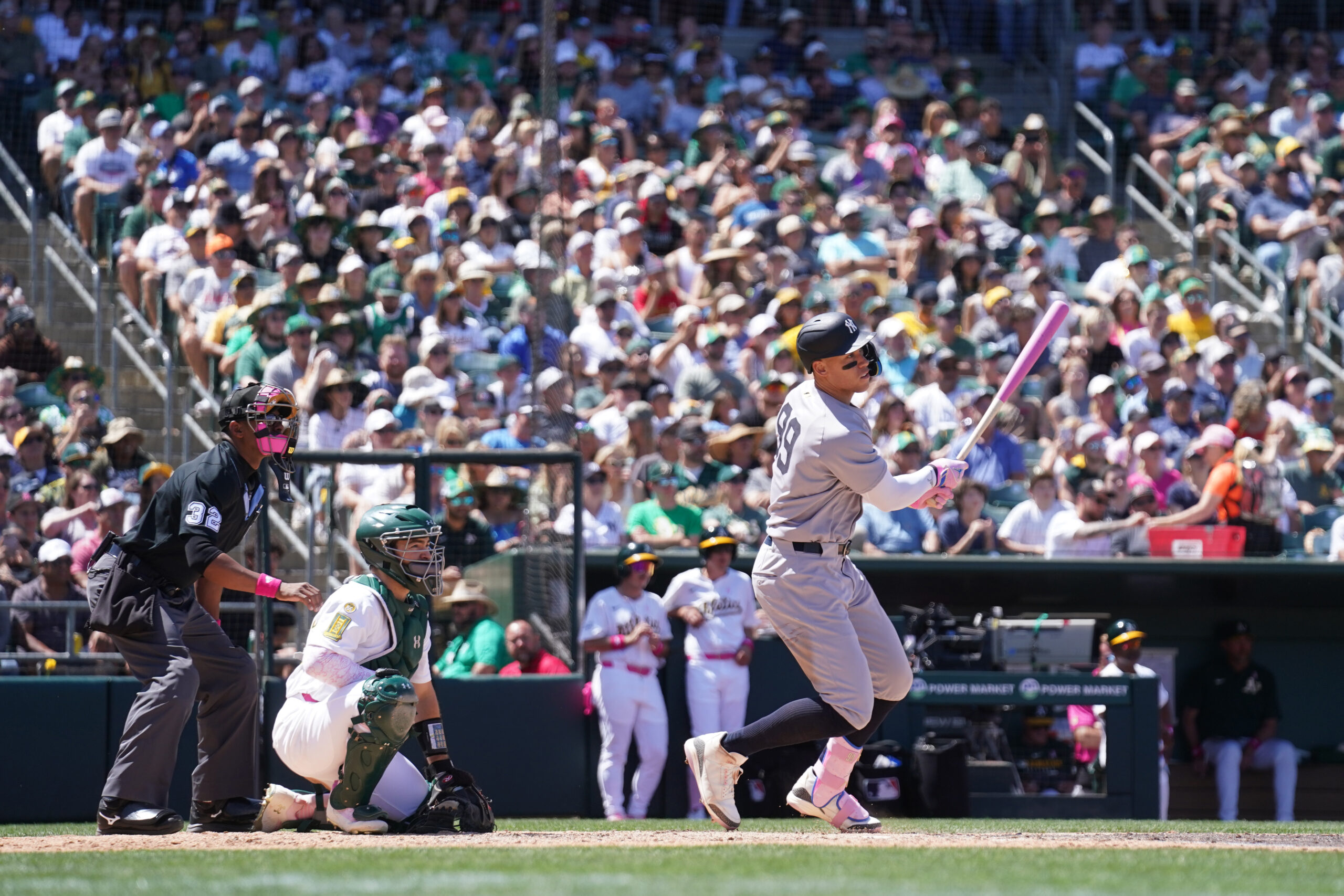 May 11, 2025; West Sacramento, California, USA; New York Yankees right fielder Aaron Judge (99) hits a single against the Athletics in the fifth inning at Sutter Health Park. Mandatory Credit: Cary Edmondson-Imagn Images