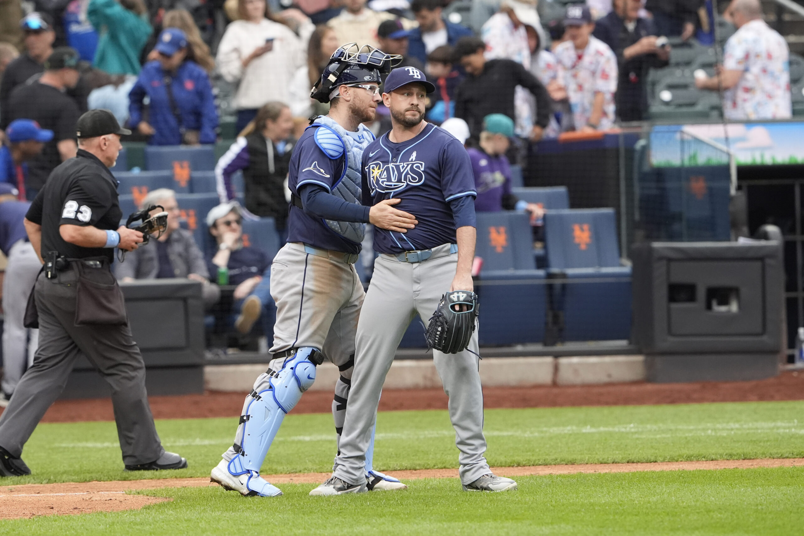 Jun 15, 2025; New York City, New York, USA; Tampa Bay Rays catcher Danny Jansen (19) and pitcher Cole Sulser (71)  celebrate the victory against the New York Mets after the ninth inning at Citi Field. Mandatory Credit: Gregory Fisher-Imagn Images