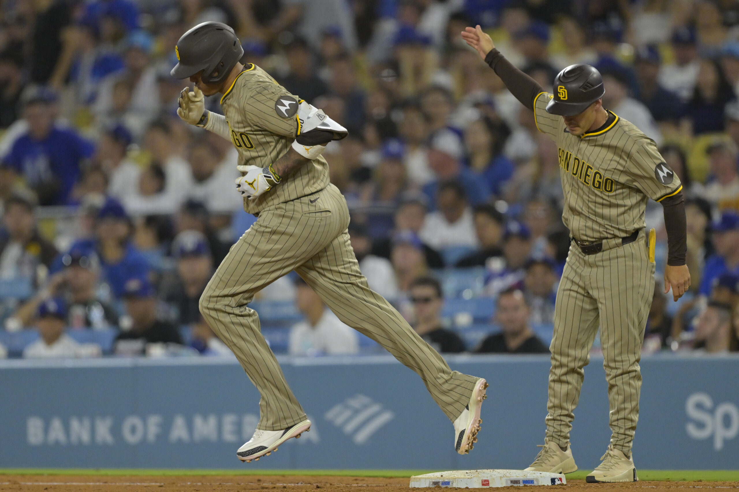 Jun 16, 2025; Los Angeles, California, USA;  San Diego Padres third baseman Manny Machado (13) rounds the bases after a solo home run in the sixth inning against the Los Angeles Dodgers at Dodger Stadium. Mandatory Credit: Jayne Kamin-Oncea-Imagn Images