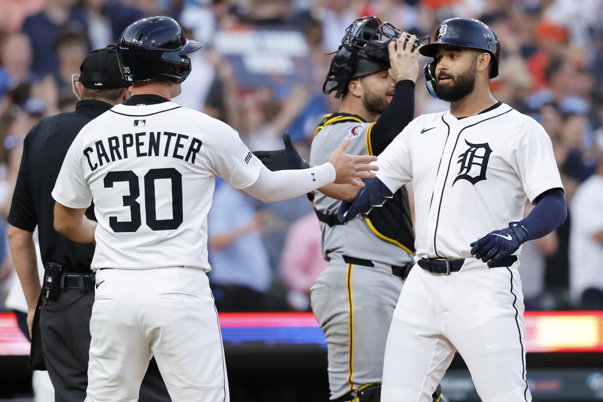 Jun 17, 2025; Detroit, Michigan, USA;  Detroit Tigers outfielder Riley Greene (31) celebrates with outfielder Kerry Carpenter (30) after he hits a two-run home run in the seventh inning against the Pittsburgh Pirates at Comerica Park. Mandatory Credit: Rick Osentoski-Imagn Images