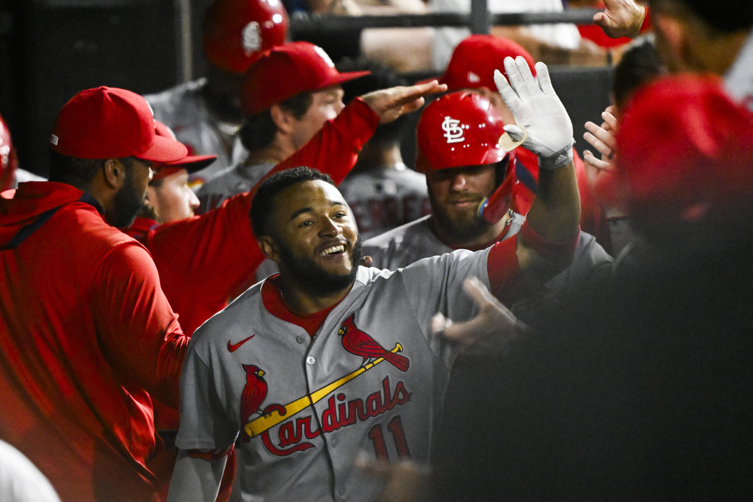 Jun 17, 2025; Chicago, Illinois, USA;  St. Louis Cardinals outfielder Victor Scott II (11) celebrates in the dugout after hitting a two-run home run against the Chicago White Sox during the ninth inning at Rate Field. Mandatory Credit: Matt Marton-Imagn Images