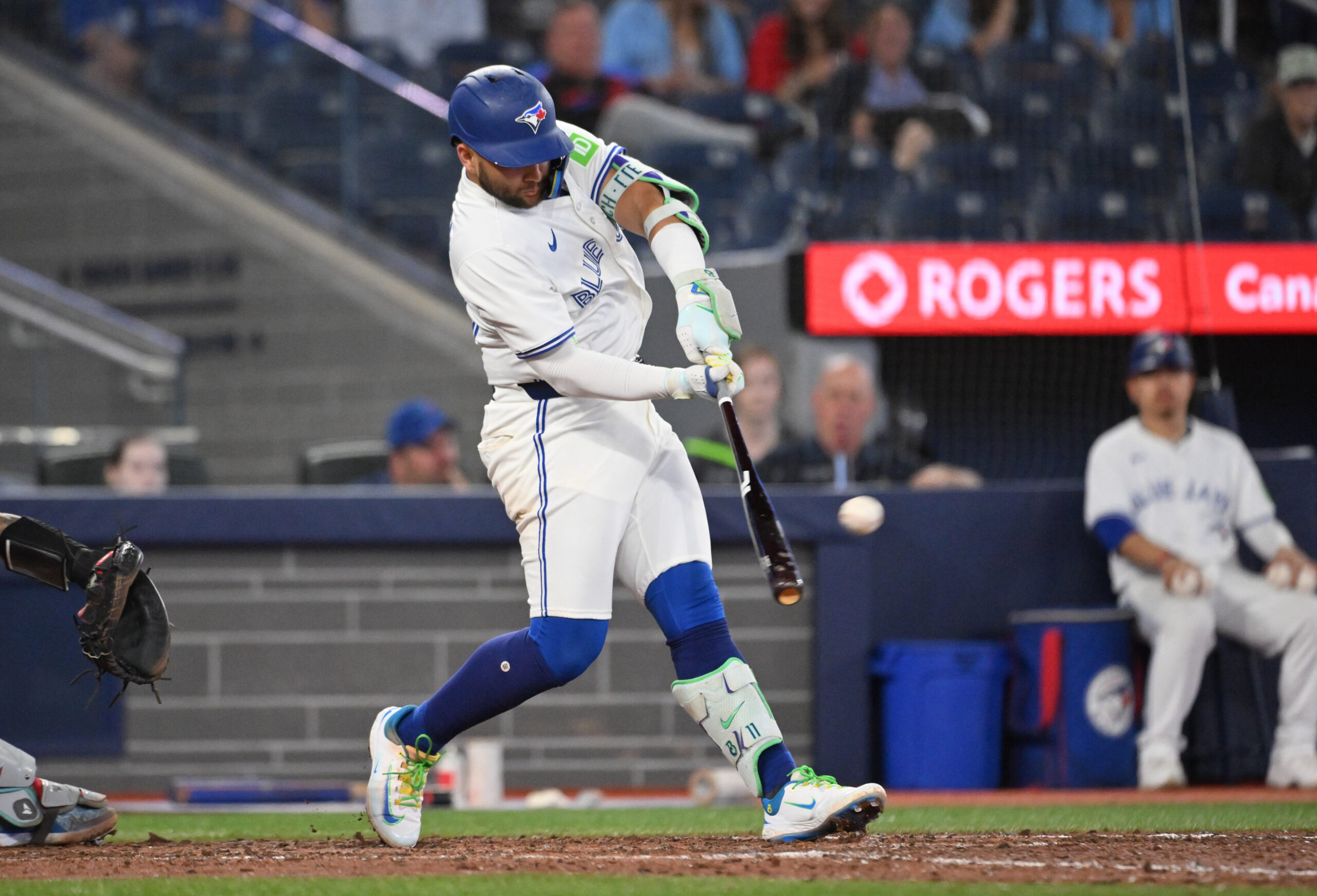 Jun 17, 2025; Toronto, Ontario, CAN;   Toronto Blue Jays shortstop Bo Bichette (11) hits a solo home run against the Arizona Diamondbacks in the ninth inning at Rogers Centre. Mandatory Credit: Dan Hamilton-Imagn Images