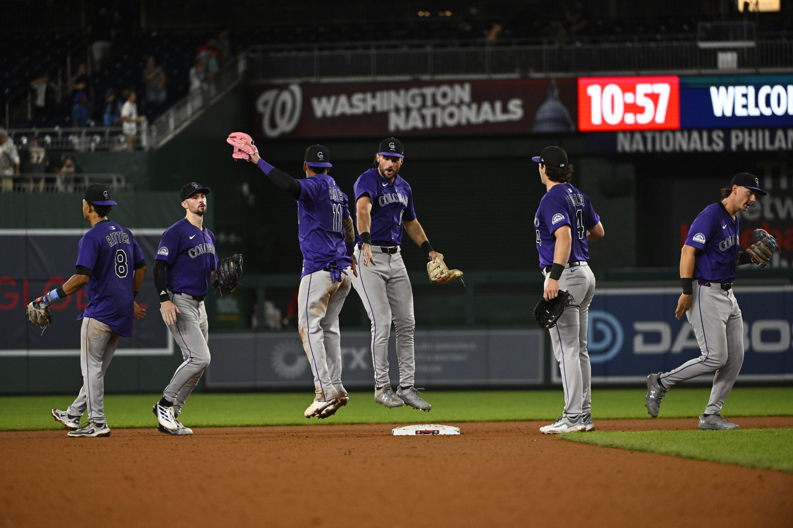 Jun 18, 2025; Washington, District of Columbia, USA; Colorado Rockies celebrate after defeating the Washington Nationals at Nationals Park. Mandatory Credit: Brad Mills-Imagn Images