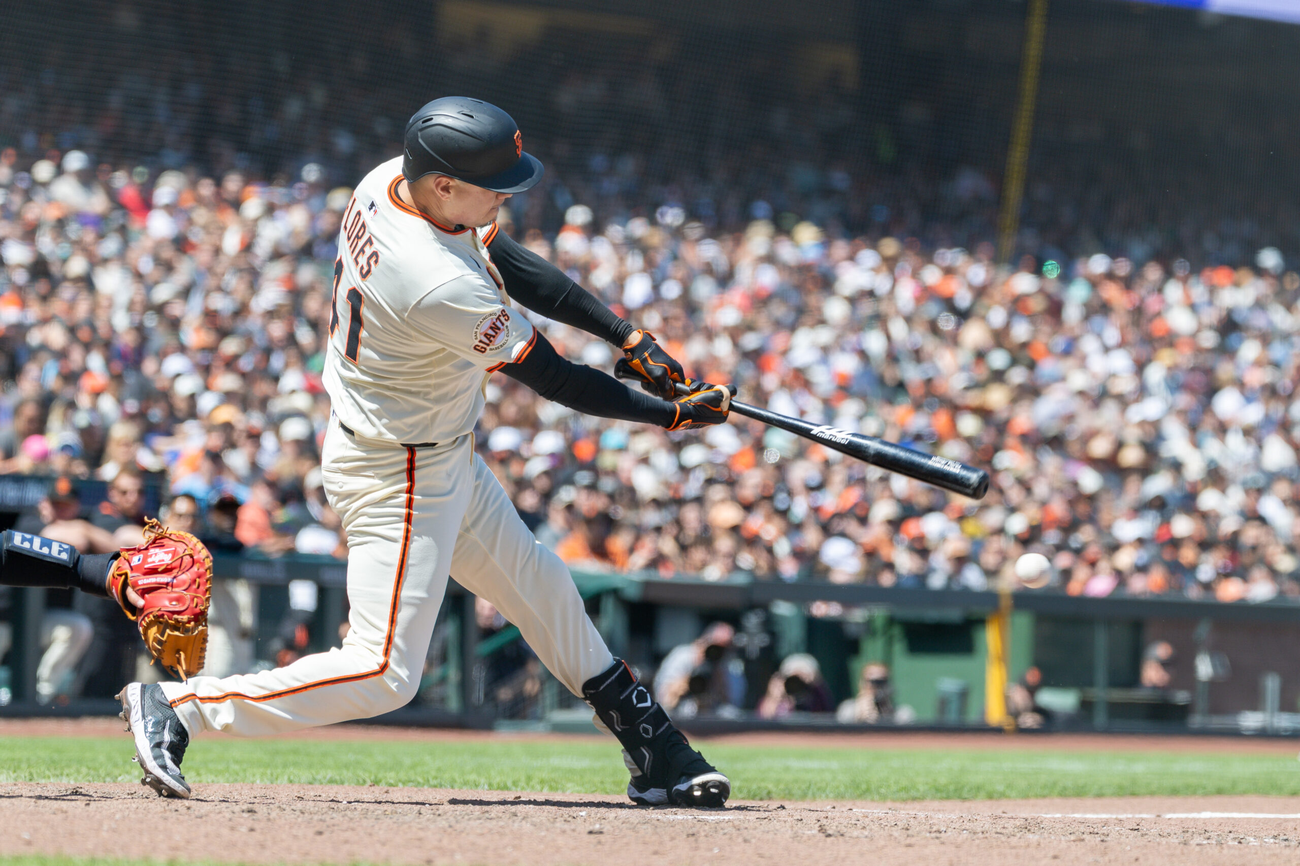 Jun 19, 2025; San Francisco, California, USA; San Francisco Giants first base Wilmer Flores (41) hits a double to score 2 runs during the seventh inning against the Cleveland Guardians at Oracle Park. Mandatory Credit: Bob Kupbens-Imagn Images