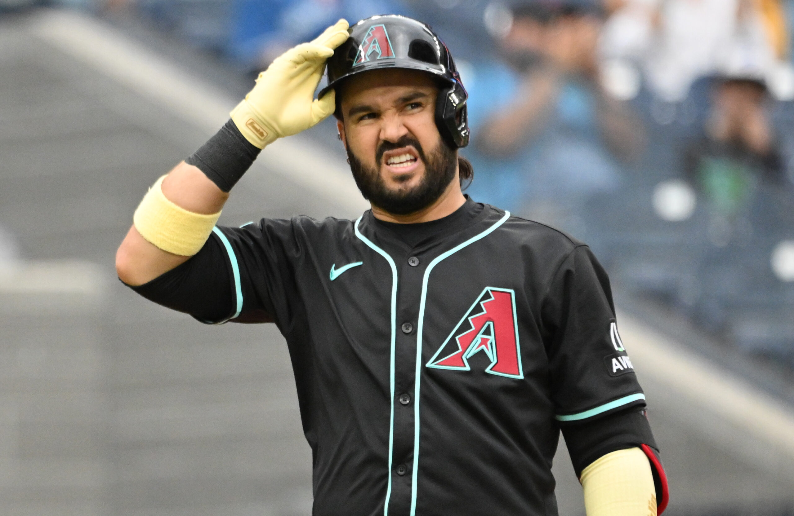 Jun 19, 2025; Toronto, Ontario, CAN;  Arizona Diamondbacks third baseman Eugenio Suarez (28) reacts after striking out against the Toronto Blue Jays in the ninth inning at Rogers Centre. Mandatory Credit: Dan Hamilton-Imagn Images