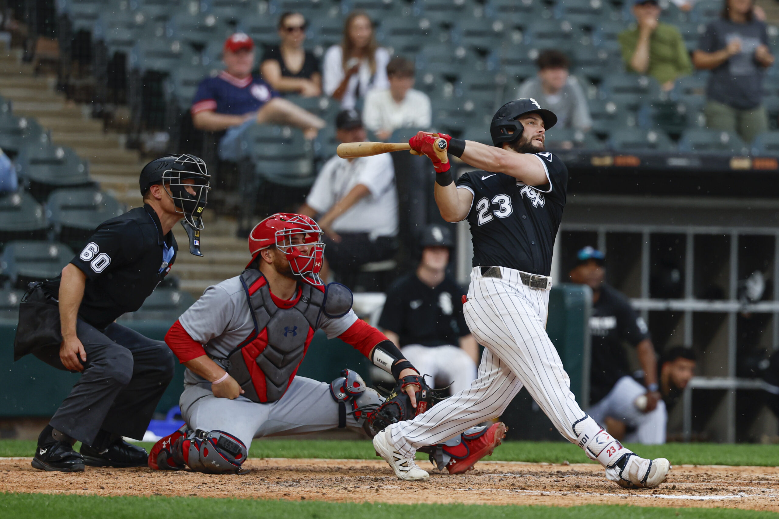 Jun 19, 2025; Chicago, Illinois, USA; Chicago White Sox left fielder Andrew Benintendi (23) hits a grand slam against the St. Louis Cardinals during the seventh inning of game two of a doubleheader at Rate Field. Mandatory Credit: Kamil Krzaczynski-Imagn Images