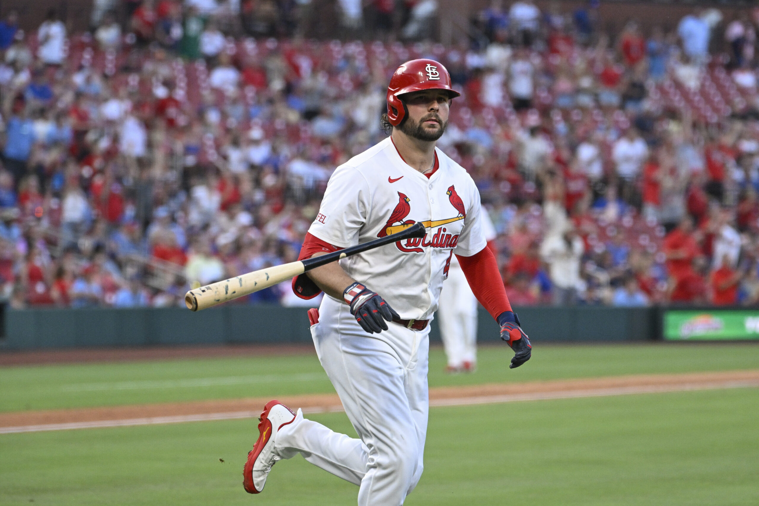 Jun 23, 2025; St. Louis, Missouri, USA; St. Louis Cardinals right fielder Alec Burleson (41) tosses his bat after hitting a two-run home run against the Chicago Cubs in the fifth inning at Busch Stadium. Mandatory Credit: Joe Puetz-Imagn Images