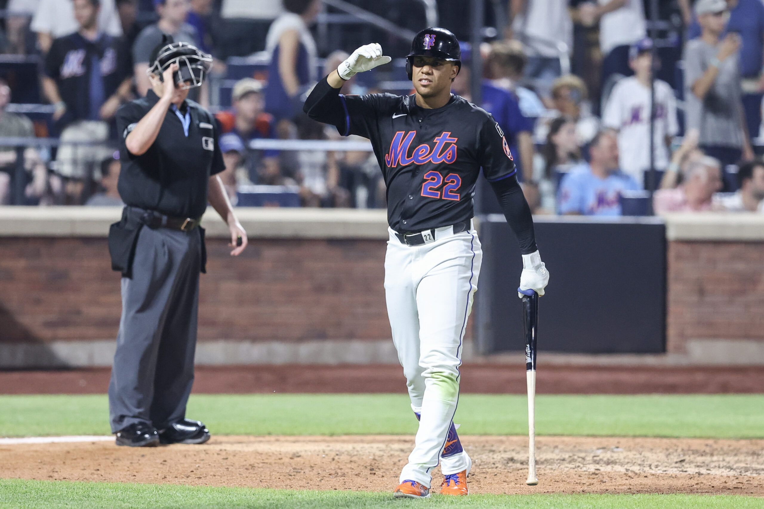 Jun 23, 2025; New York City, New York, USA;  New York Mets right fielder Juan Soto (22) reacts after striking out with the bases loaded in the eighth inning against the Atlanta Braves at Citi Field. Mandatory Credit: Wendell Cruz-Imagn Images