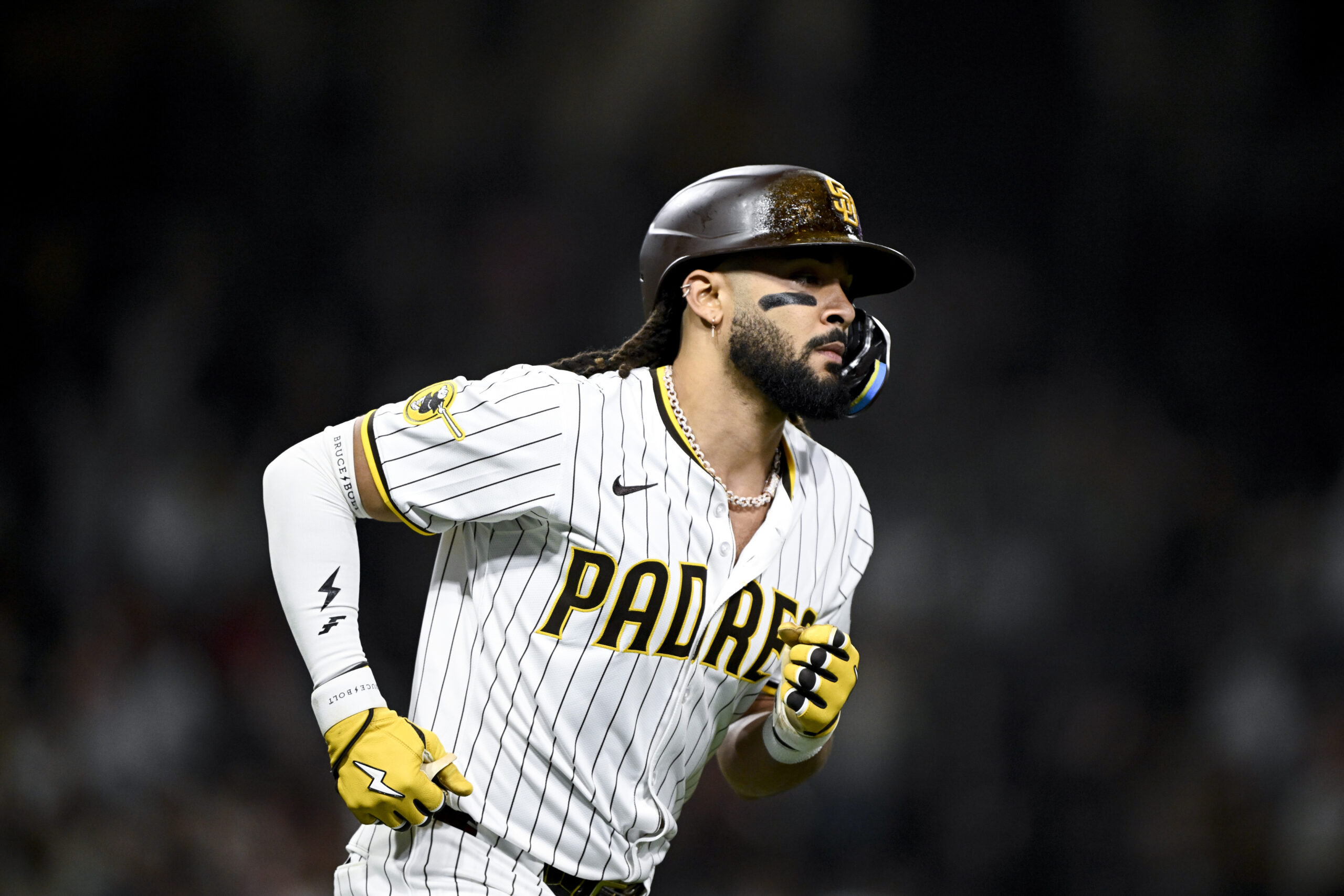 Jun 23, 2025; San Diego, California, USA; San Diego Padres right fielder Fernando Tatis Jr. (23) rounds the bases after hitting a solo home run during the ninth inning against the Washington Nationals at Petco Park. Mandatory Credit: Denis Poroy-Imagn Images