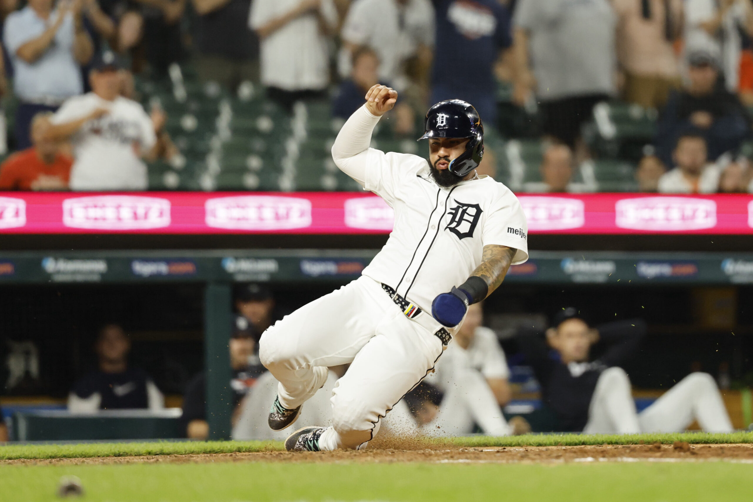 Jun 24, 2025; Detroit, Michigan, USA; Detroit Tigers outfielder Javier Baez (28) scores a run in the eighth inning against the Athletics at Comerica Park. Mandatory Credit: Rick Osentoski-Imagn Images