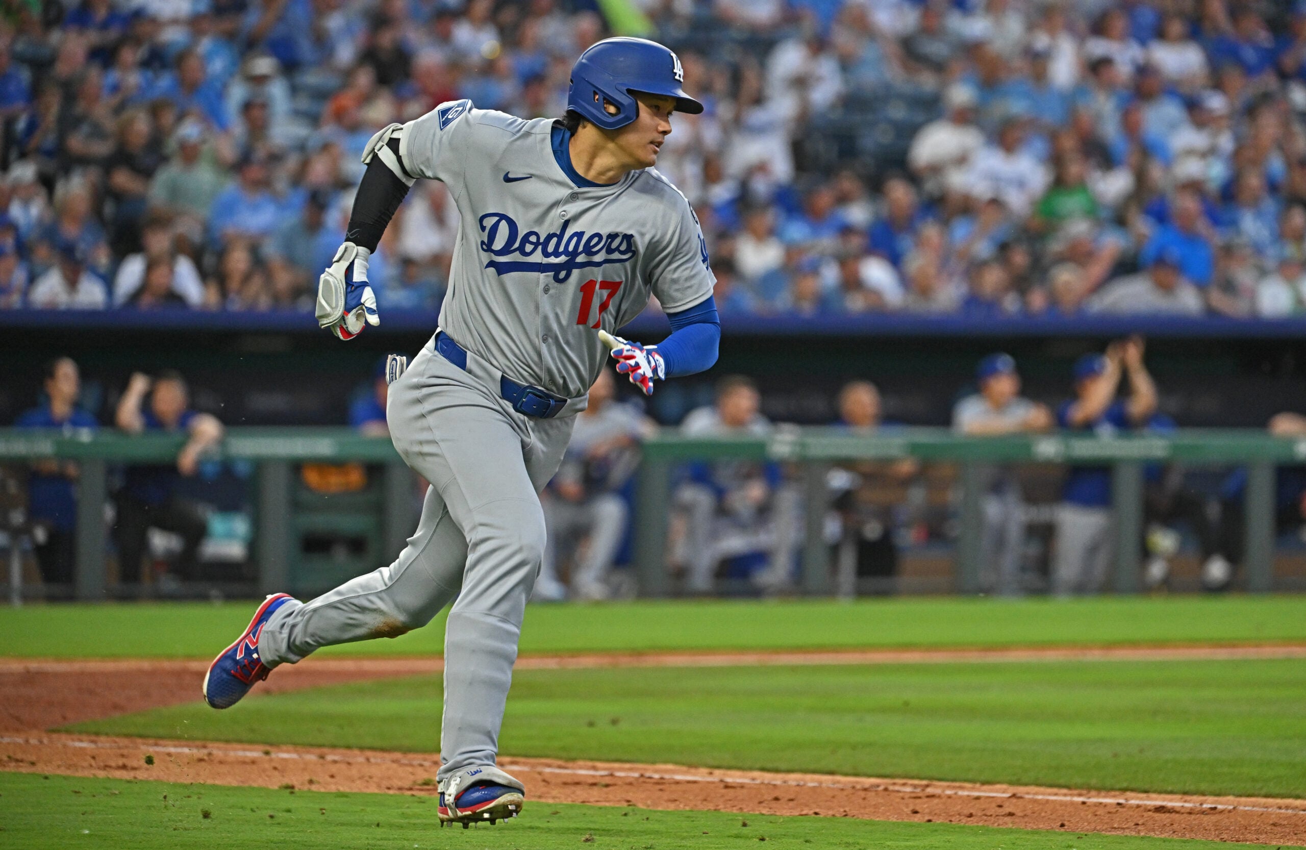 Jun 27, 2025; Kansas City, Missouri, USA; Los Angeles Dodgers designated hitter Shohei Ohtani (17) hits an RBI triple in the fifth inning against the Kansas City Royals at Kauffman Stadium. Mandatory Credit: Peter Aiken-Imagn Images