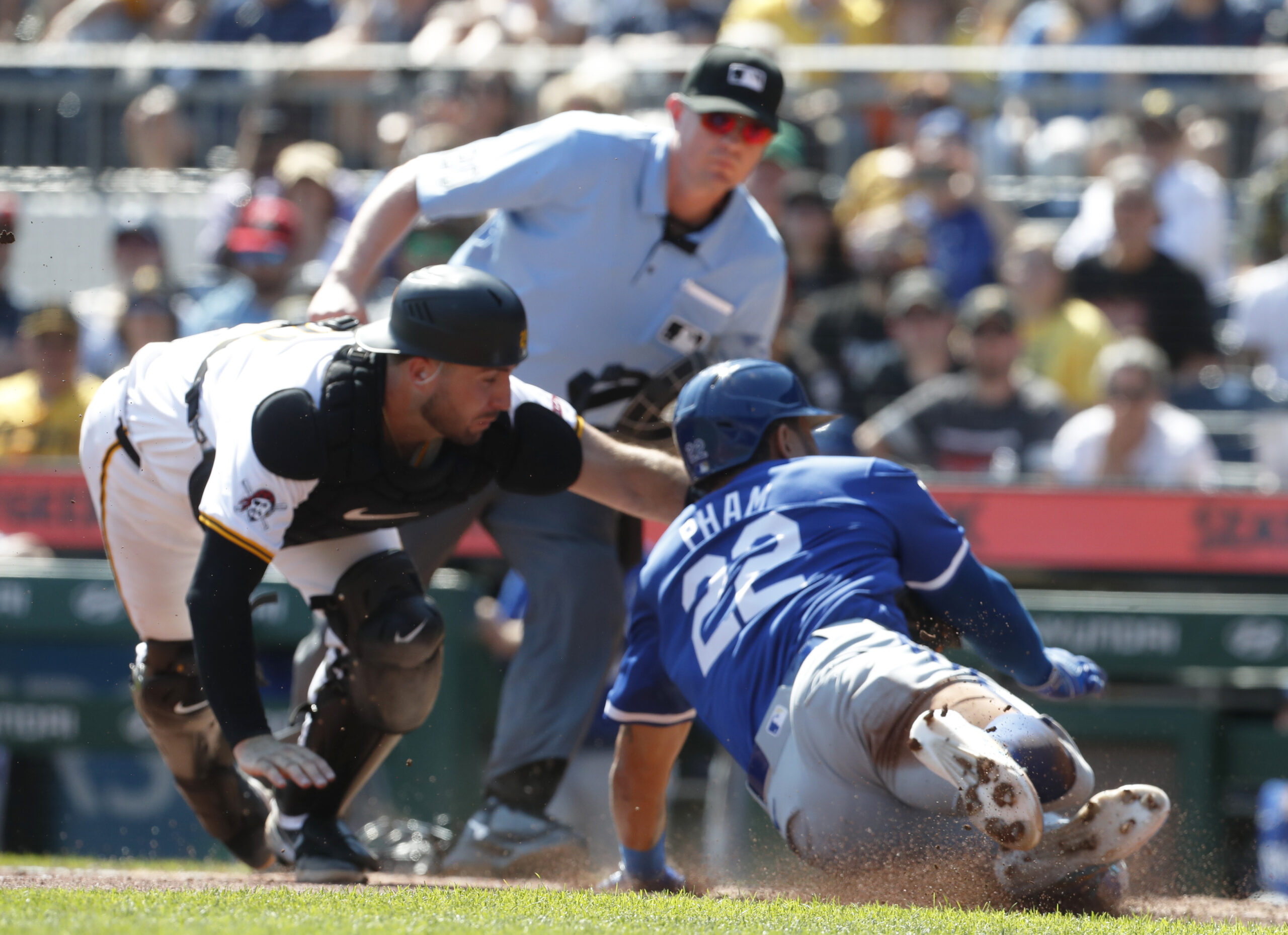 Sep 15, 2024; Pittsburgh, Pennsylvania, USA;  Pittsburgh Pirates catcher Joey Bart (14) tags Kansas City Royals outfielder Tommy Pham (22) out at home plate attempting to score a run during the third inning at PNC Park. Mandatory Credit: Charles LeClaire-Imagn Images