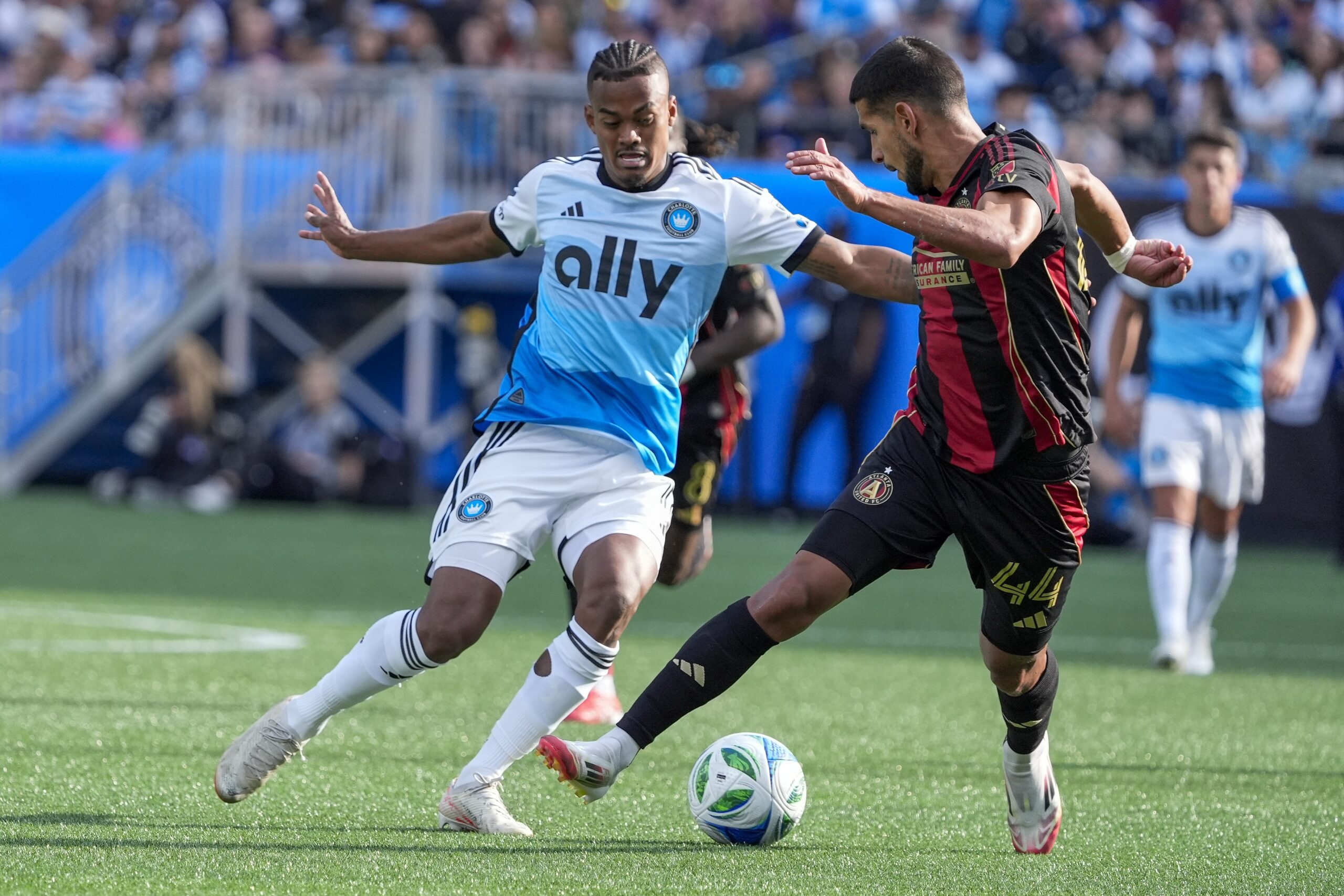 Mar 1, 2025; Charlotte, North Carolina, USA; Charlotte FC forward Kerwin Vargas (18) and Atlanta United defender Luis Abram (44) battle for the ball during the second half  at Bank of America Stadium. Mandatory Credit: Jim Dedmon-Imagn Images