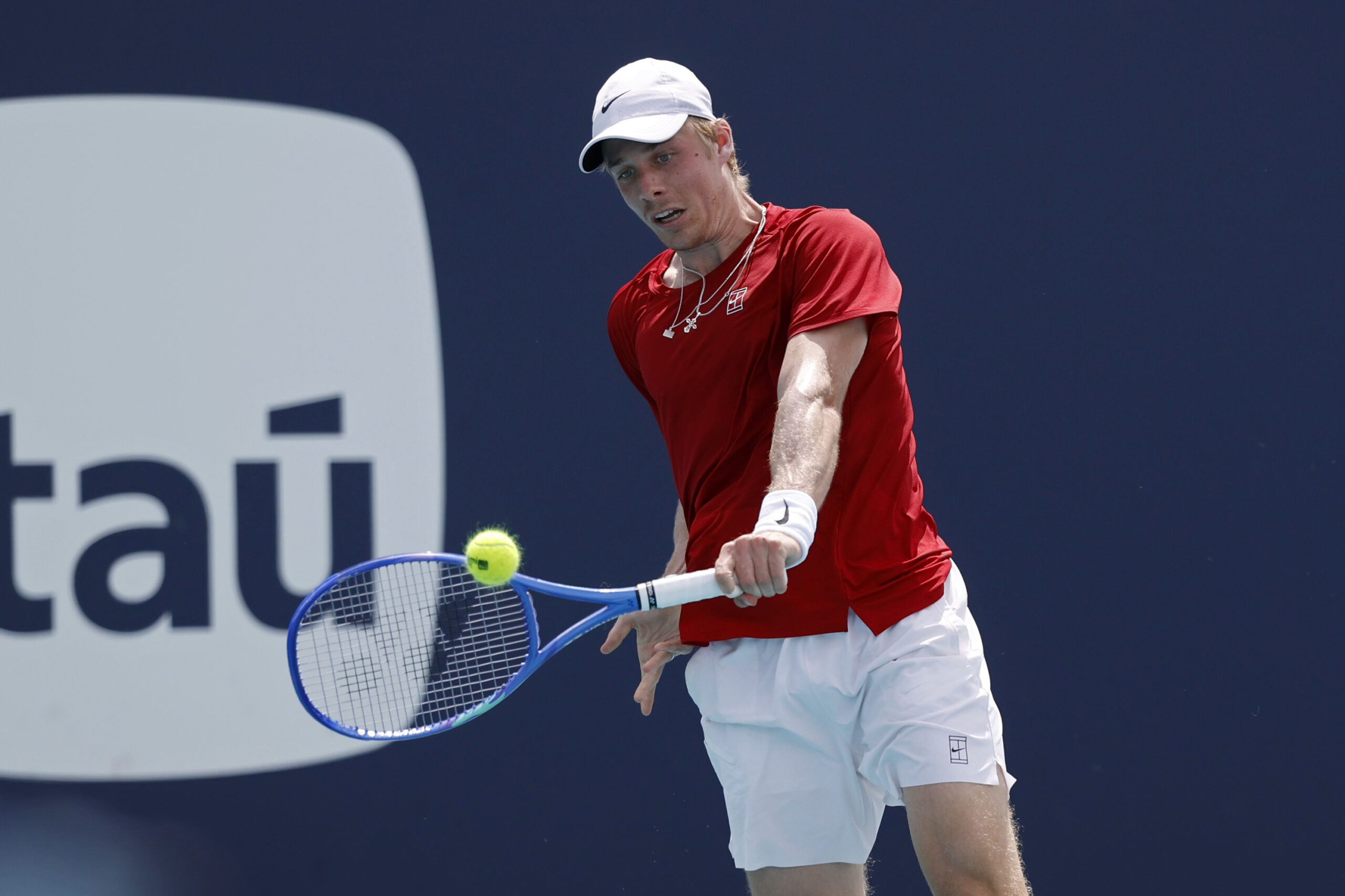 Mar 24, 2025; Miami, FL, USA; Denis Shapovalov (CAN) hits a backhand against Taylor Fritz (USA)(not pictured) on day seven of the Miami Open at Hard Rock Stadium. Mandatory Credit: Geoff Burke-Imagn Images