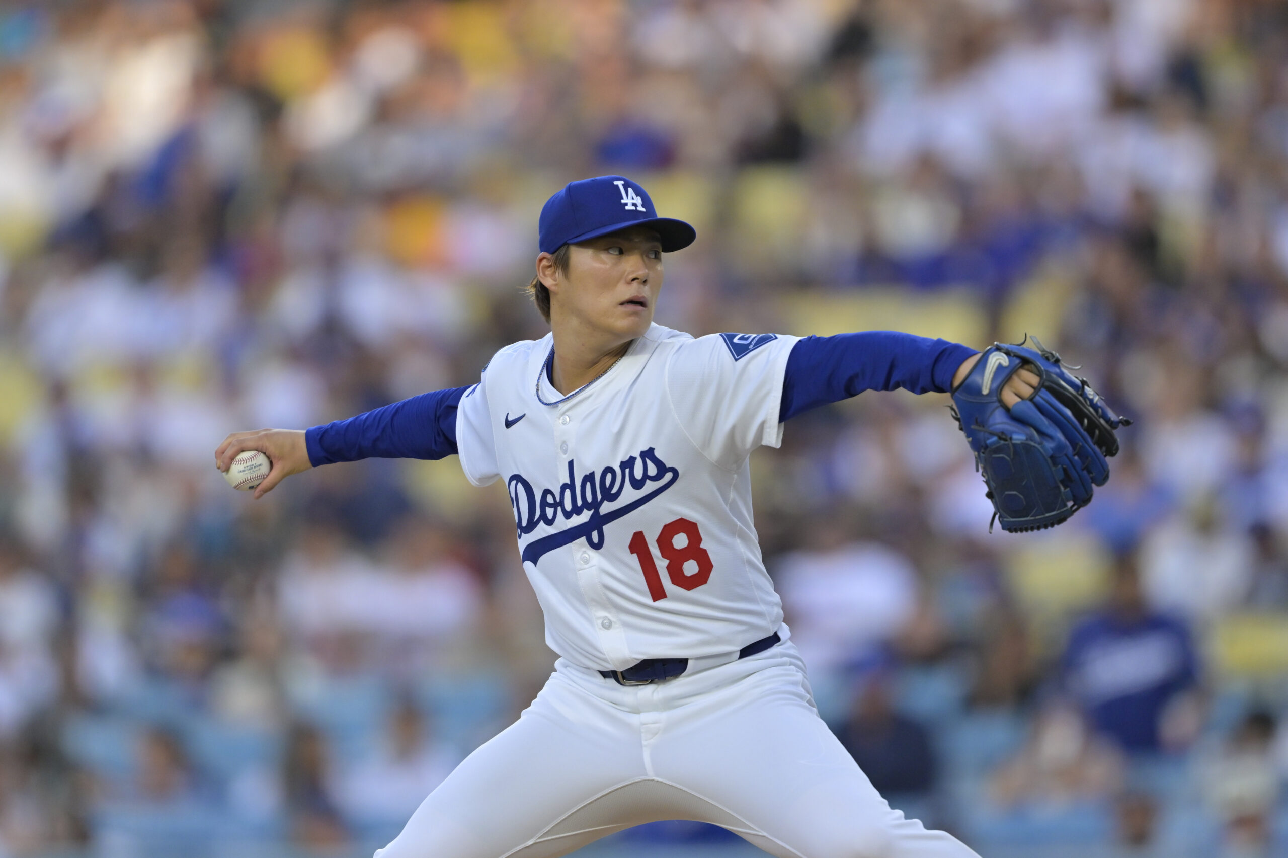 Jun 19, 2025; Los Angeles, California, USA; Los Angeles Dodgers pitcher Yoshinobu Yamamoto (18) delivers a pitch during the first inning against the San Diego Padres at Dodger Stadium. Mandatory Credit: Jayne Kamin-Oncea-Imagn Images