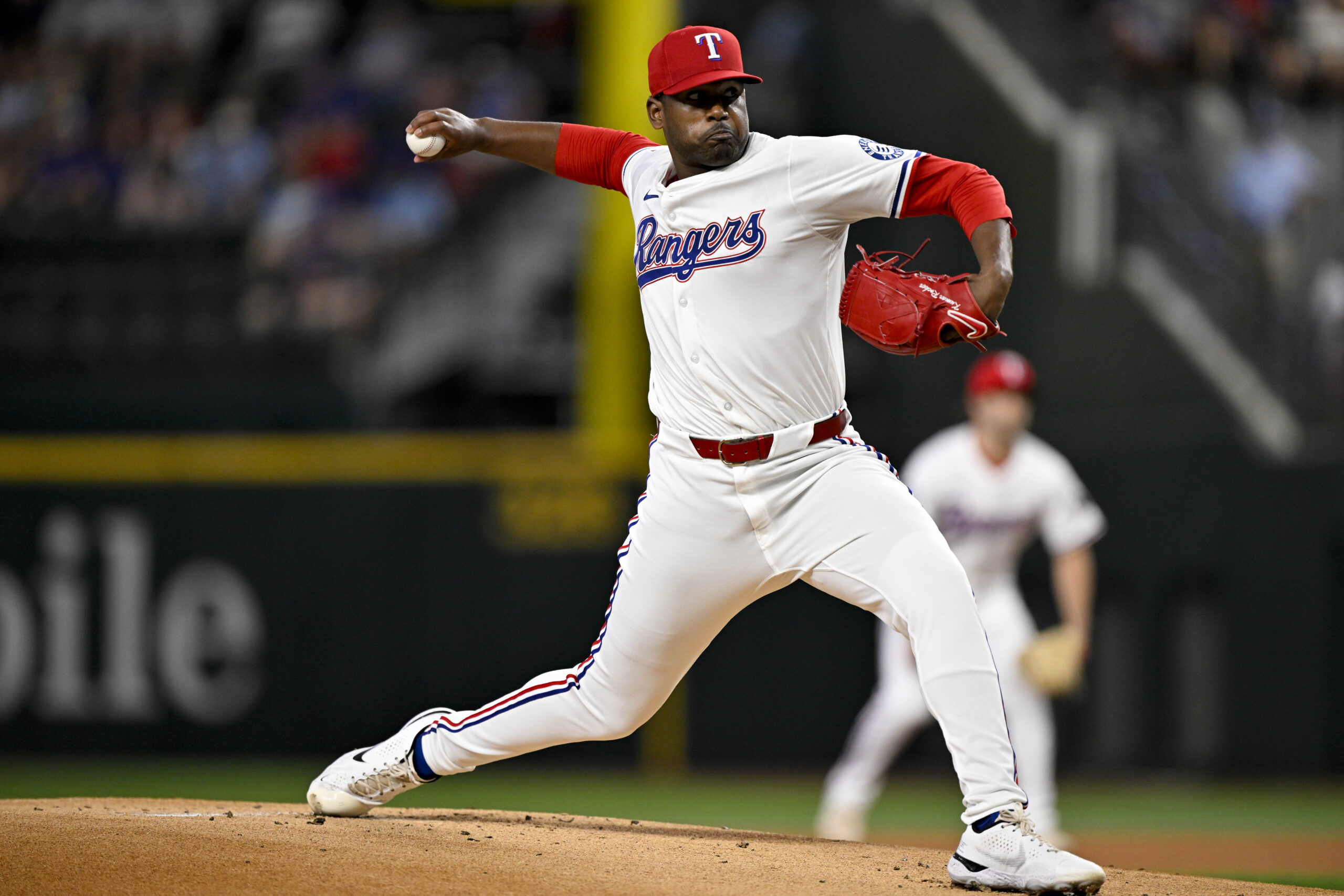 Jun 28, 2025; Arlington, Texas, USA; Texas Rangers starting pitcher Kumar Rocker (80) pitches against the Seattle Mariners during the first inning at Globe Life Field. Mandatory Credit: Jerome Miron-Imagn Images