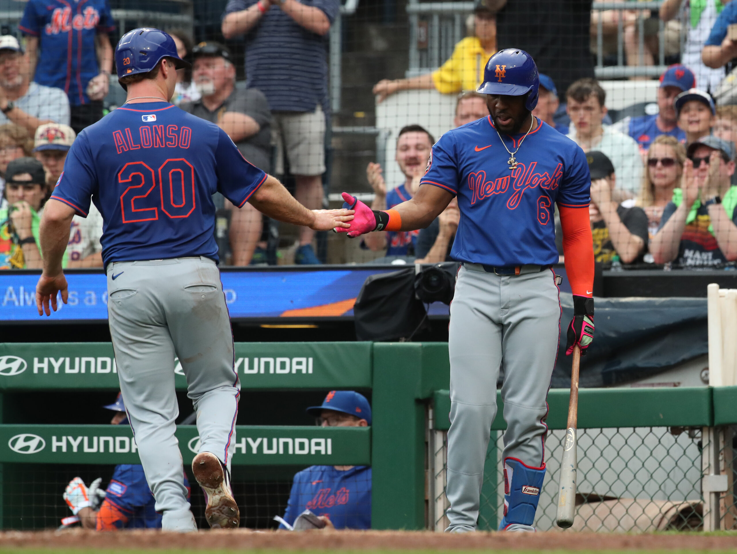 Jun 28, 2025; Pittsburgh, Pennsylvania, USA; New York Mets first baseman Pete Alonso (20) celebrates scoring a run with designated hitter Starling Marte (6) against the Pittsburgh Pirates during the fifth inning at PNC Park. Mandatory Credit: Charles LeClaire-Imagn Images
