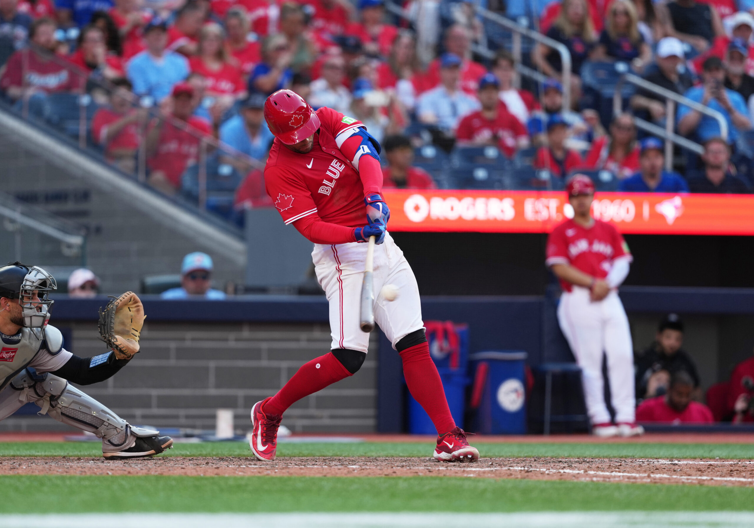 Jul 1, 2025; Toronto, Ontario, CAN; Toronto Blue Jays right fielder George Springer (4) hits a two run single against the New York Yankees during the eighth inning at Rogers Centre. Mandatory Credit: Nick Turchiaro-Imagn Images