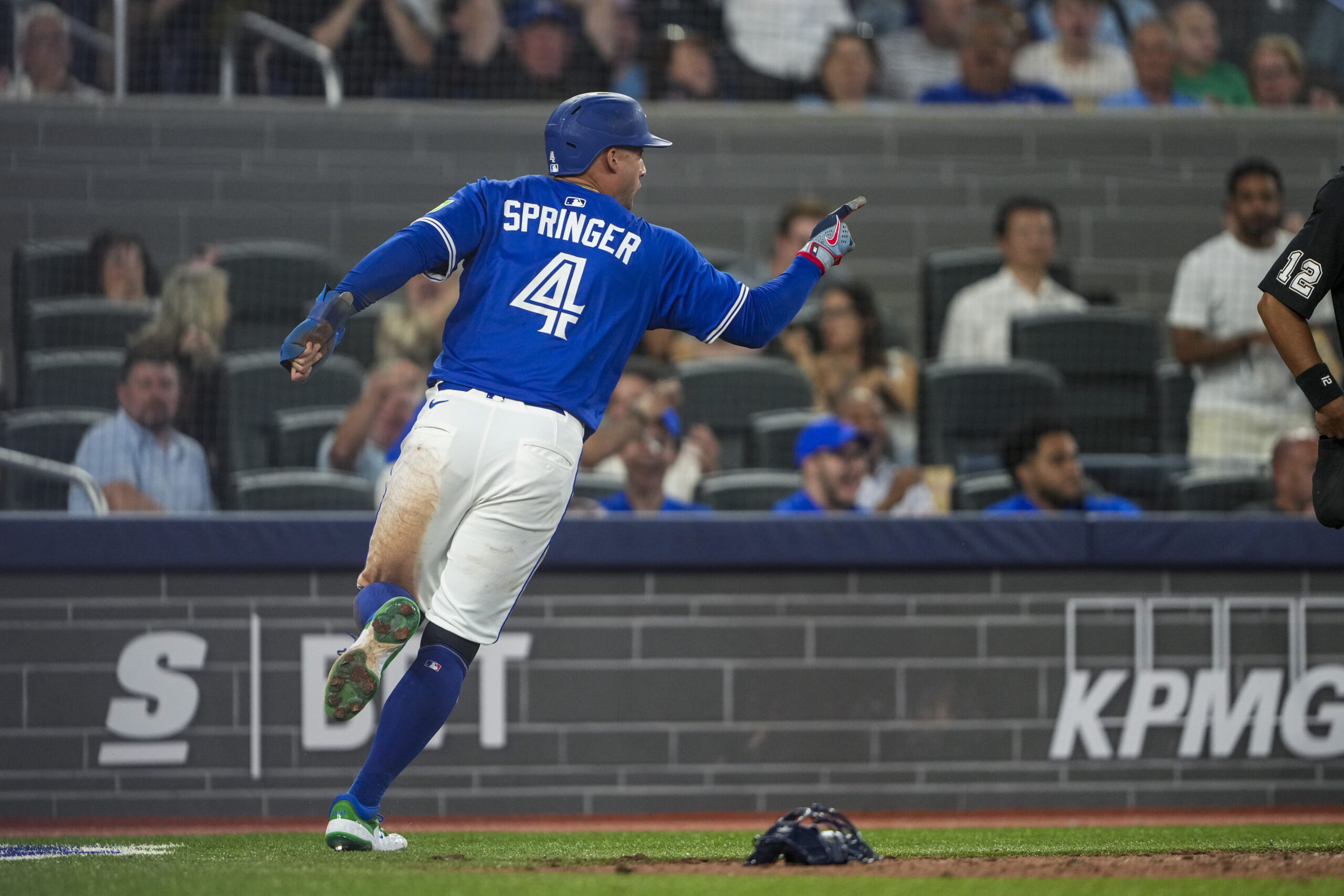 Jul 2, 2025; Toronto, Ontario, CAN; Toronto Blue Jays outfielder George Springer (4) celebrates after scoring against the New York Yankees during the eighth inning at Rogers Centre. Mandatory Credit: Kevin Sousa-Imagn Images
