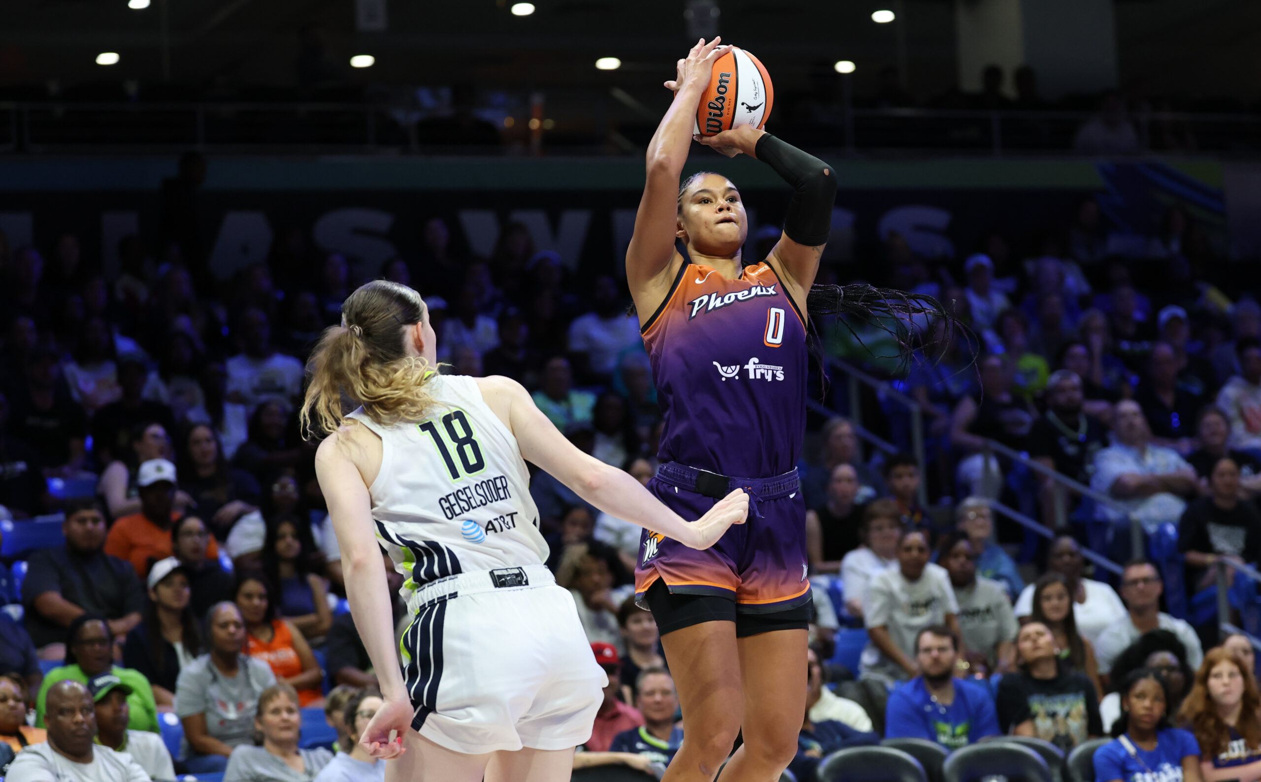 Jul 3, 2025; Arlington, Texas, USA;  Phoenix Mercury forward Satou Sabally (0) shoots over Dallas Wings center Luisa Geiselsoder (18) during the second half at College Park Center. Mandatory Credit: Kevin Jairaj-Imagn Images