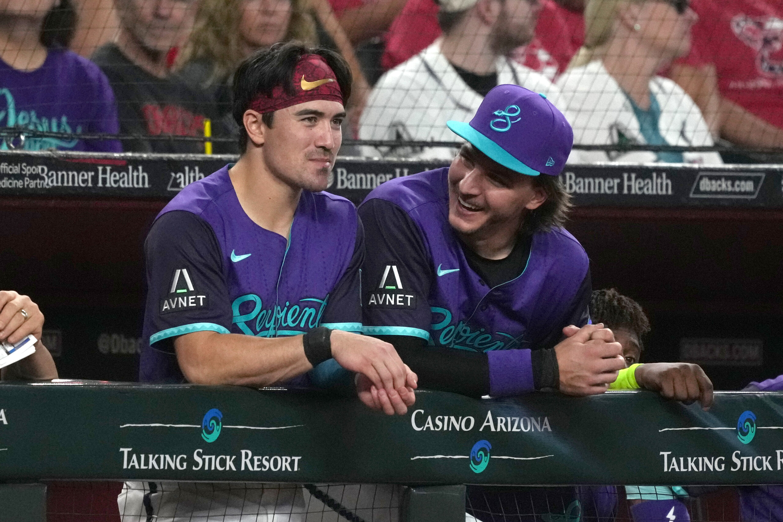 Jul 5, 2025; Phoenix, Arizona, USA; Arizona Diamondbacks outfielder Corbin Carroll (7) and  pitcher Brandon Pfaadt (32) talk against the Kansas City Royals in the first inning at Chase Field. Mandatory Credit: Rick Scuteri-Imagn Images
