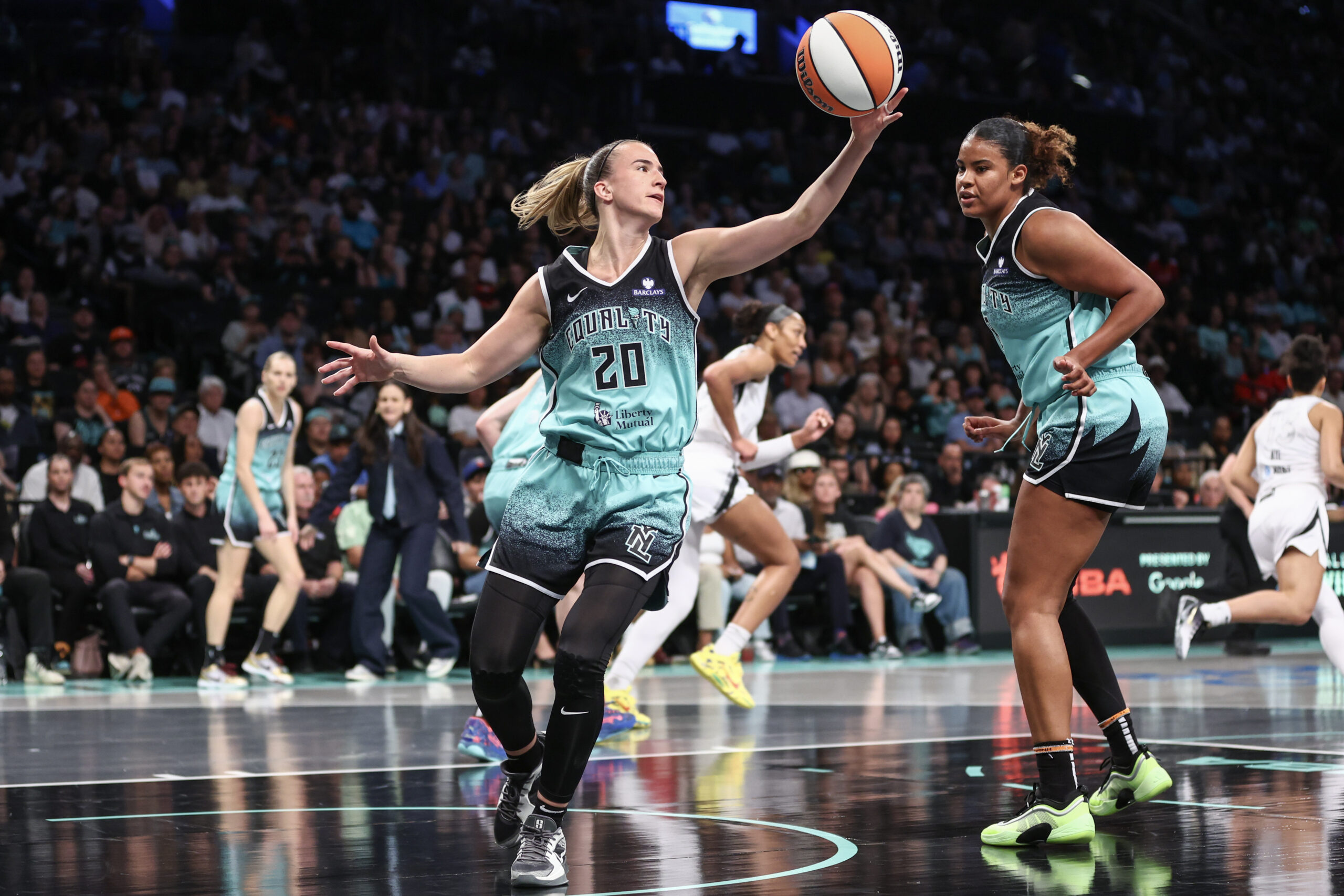 Jul 8, 2025; Brooklyn, New York, USA;  New York Liberty guard Sabrina Ionescu (20) grabs a rebound in the first quarter against the Las Vegas Aces at Barclays Center. Mandatory Credit: Wendell Cruz-Imagn Images