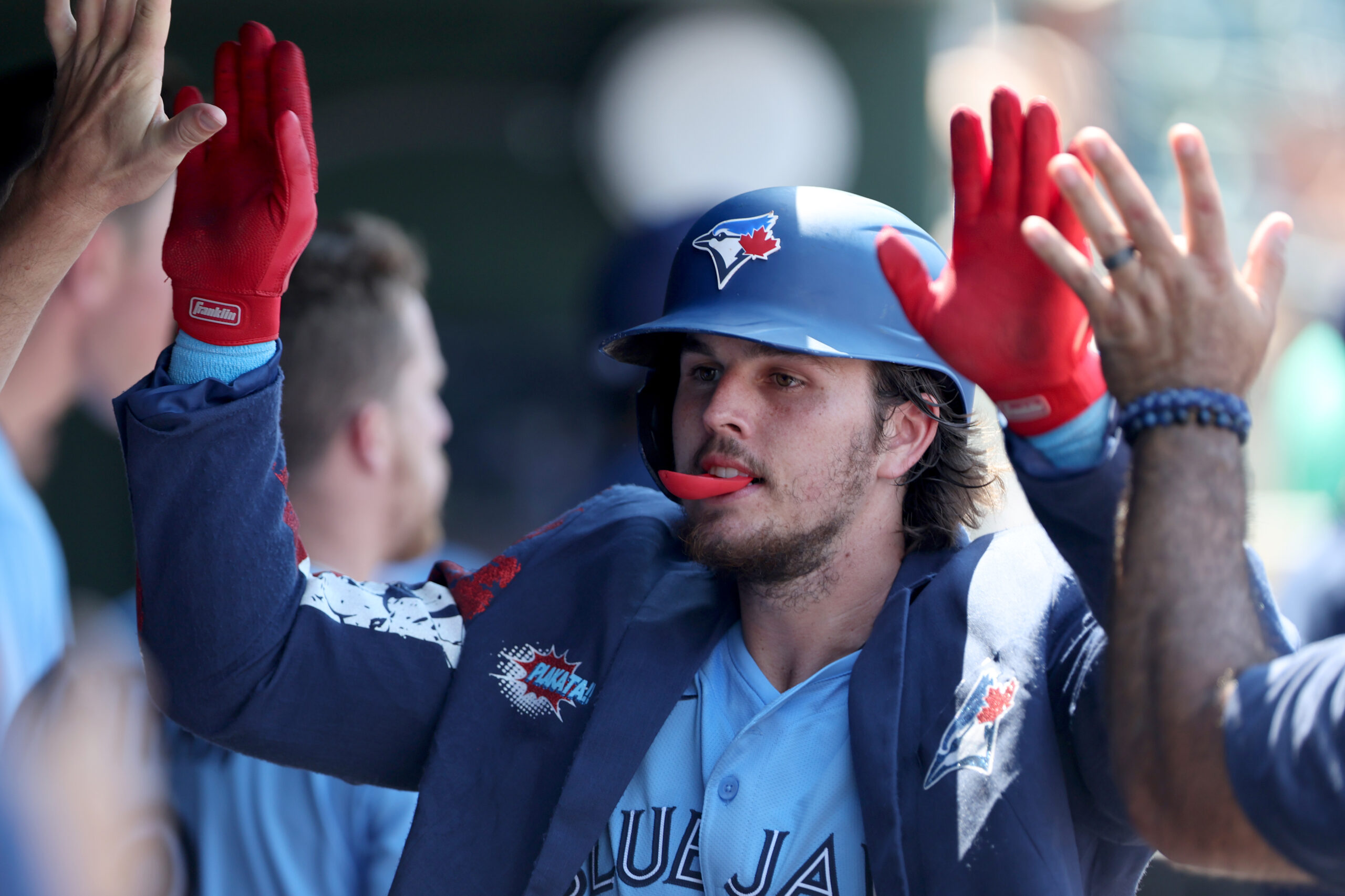 Jul 13, 2025; West Sacramento, California, USA; Toronto Blue Jays third baseman Addison Barger (47) celebrates with teammates after hitting a two-run home run against the Athletics during the seventh inning  at Sutter Health Park. Mandatory Credit: Dennis Lee-Imagn Images
