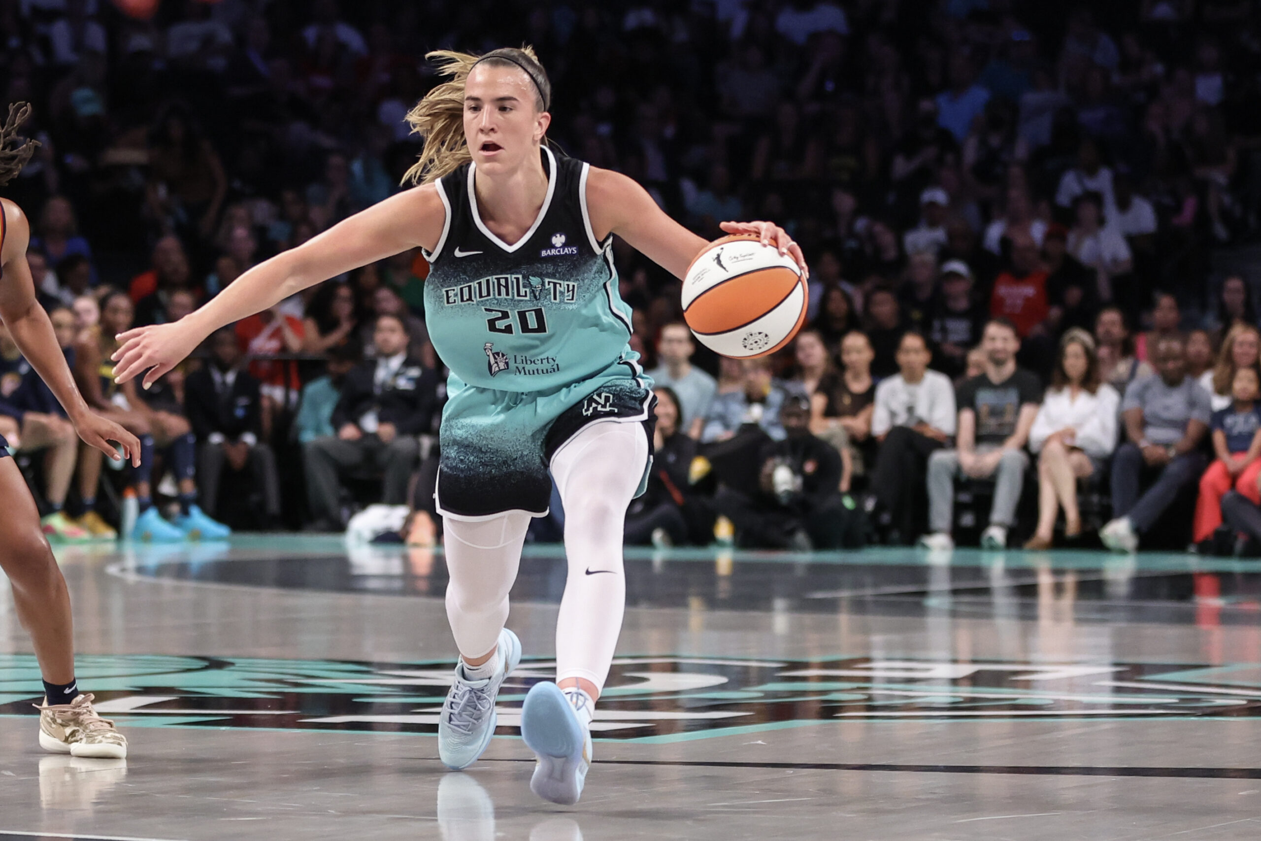 Jul 22, 2025; Brooklyn, New York, USA;  New York Liberty guard Sabrina Ionescu (20) brings the ball up court in the first quarter against the Indiana Fever at Barclays Center. Mandatory Credit: Wendell Cruz-Imagn Images