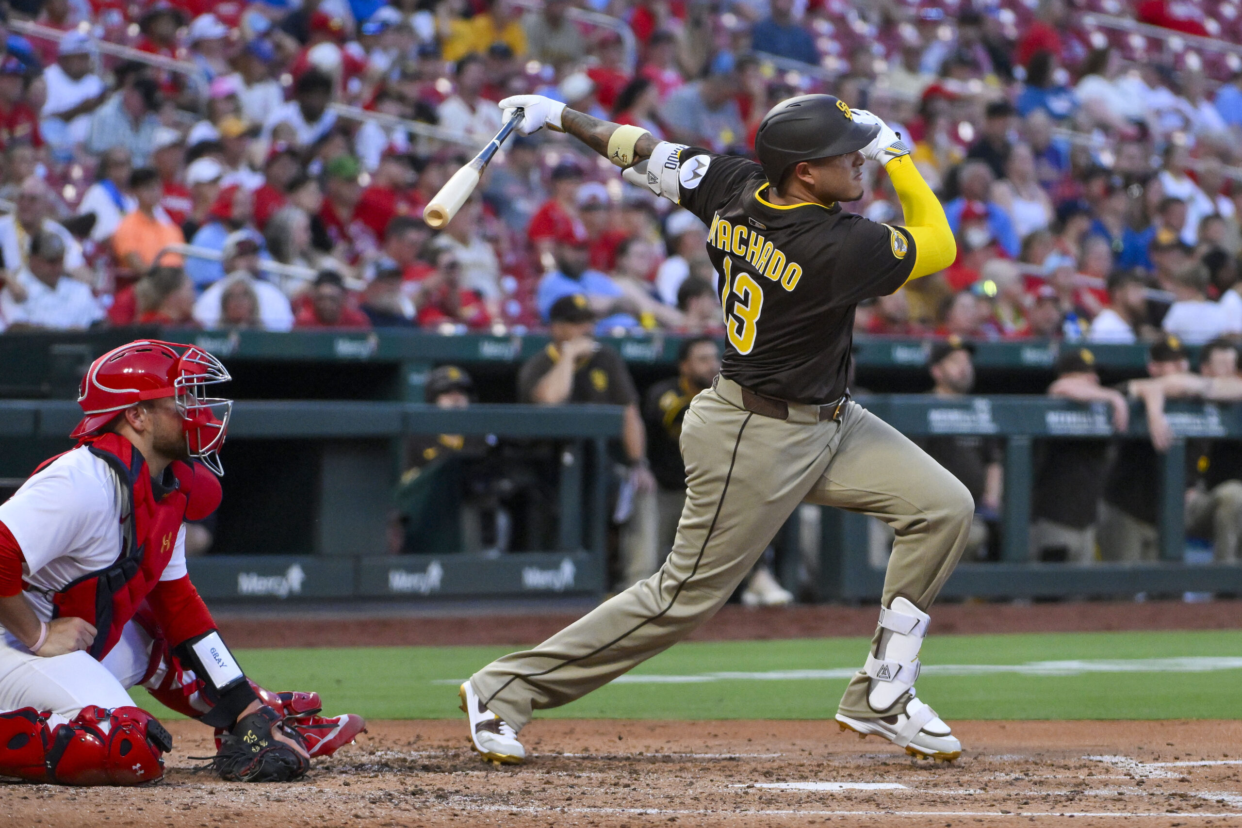 Jul 24, 2025; St. Louis, Missouri, USA;  San Diego Padres third baseman Manny Machado (13) hits a two run home run against the St. Louis Cardinals during the third inning at Busch Stadium. Mandatory Credit: Jeff Curry-Imagn Images
