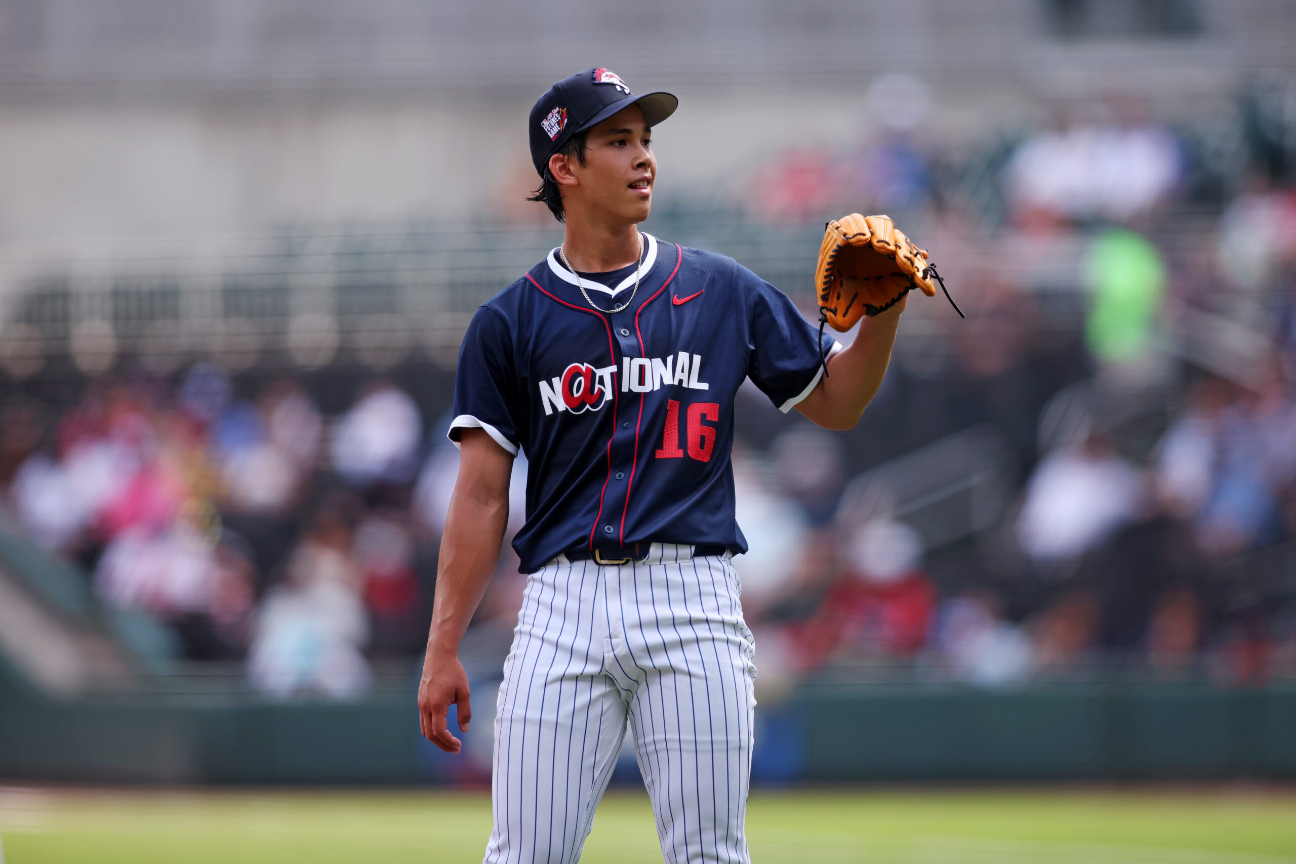 Jul 12, 2025; Atlanta, GA, USA;  National League pitcher Jonah Tong (16) reacts after a pitch during the second inning against American League at Truist Park. Mandatory Credit: Brett Davis-Imagn Images