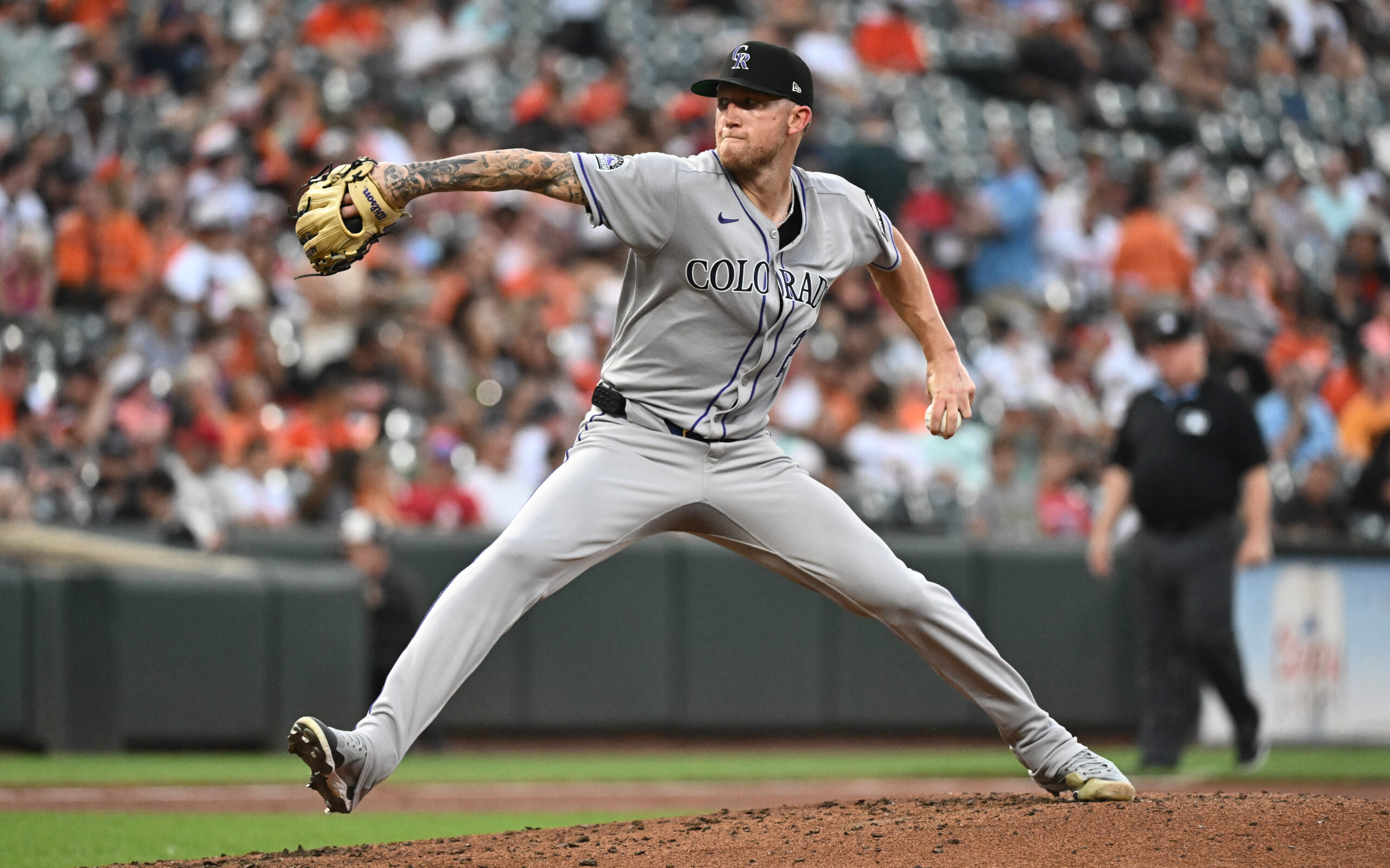 Jul 25, 2025; Baltimore, Maryland, USA;  Colorado Rockies pitcher Kyle Freeland (21) delivers a pitch during the second inning against the Baltimore Orioles at Oriole Park at Camden Yards. Mandatory Credit: James A. Pittman-Imagn Images