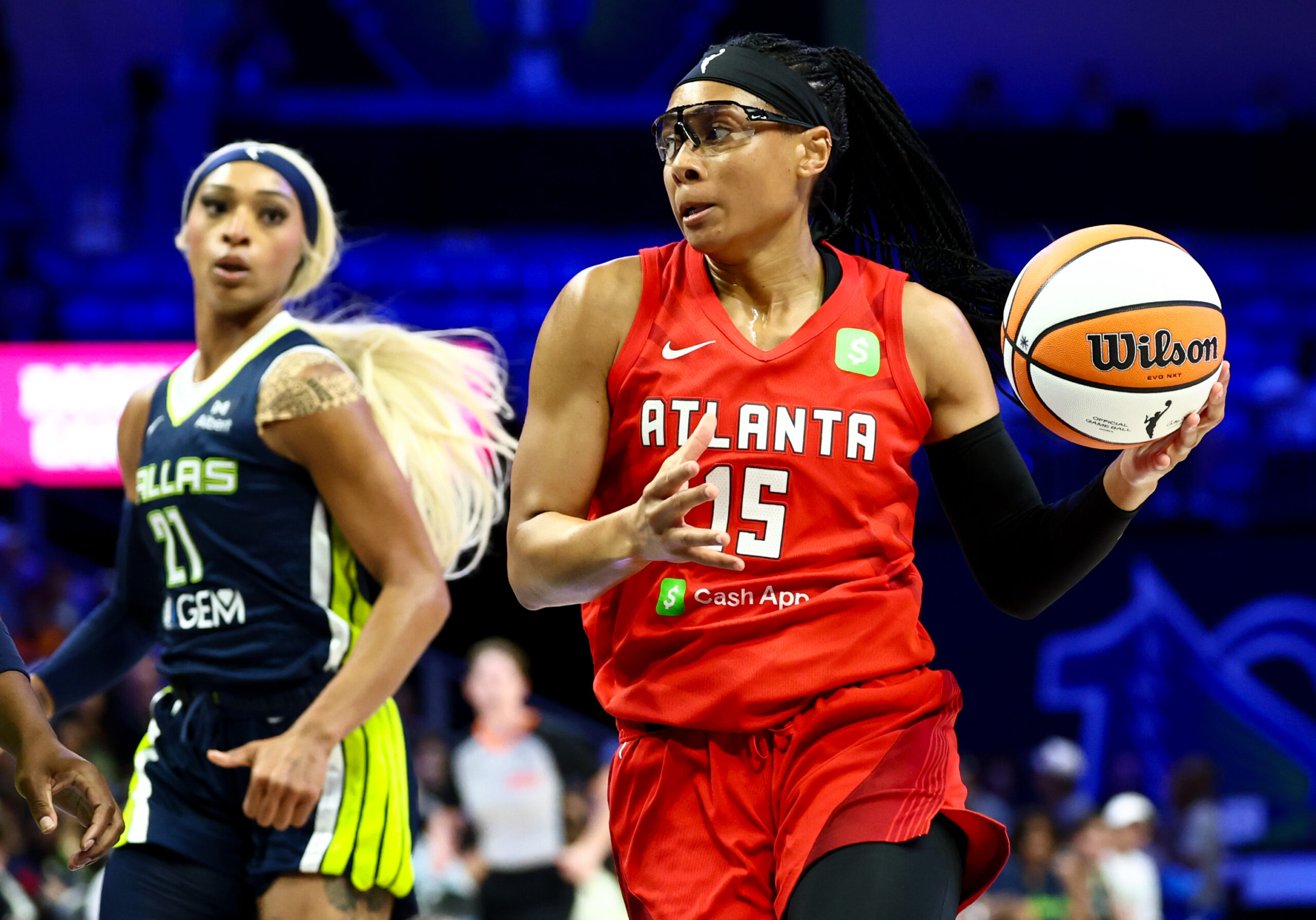 Jul 30, 2025; Arlington, Texas, USA;  Atlanta Dream guard Allisha Gray (15) drives to the basket past Dallas Wings guard DiJonai Carrington (21) during the first half at College Park Center. Mandatory Credit: Kevin Jairaj-Imagn Images