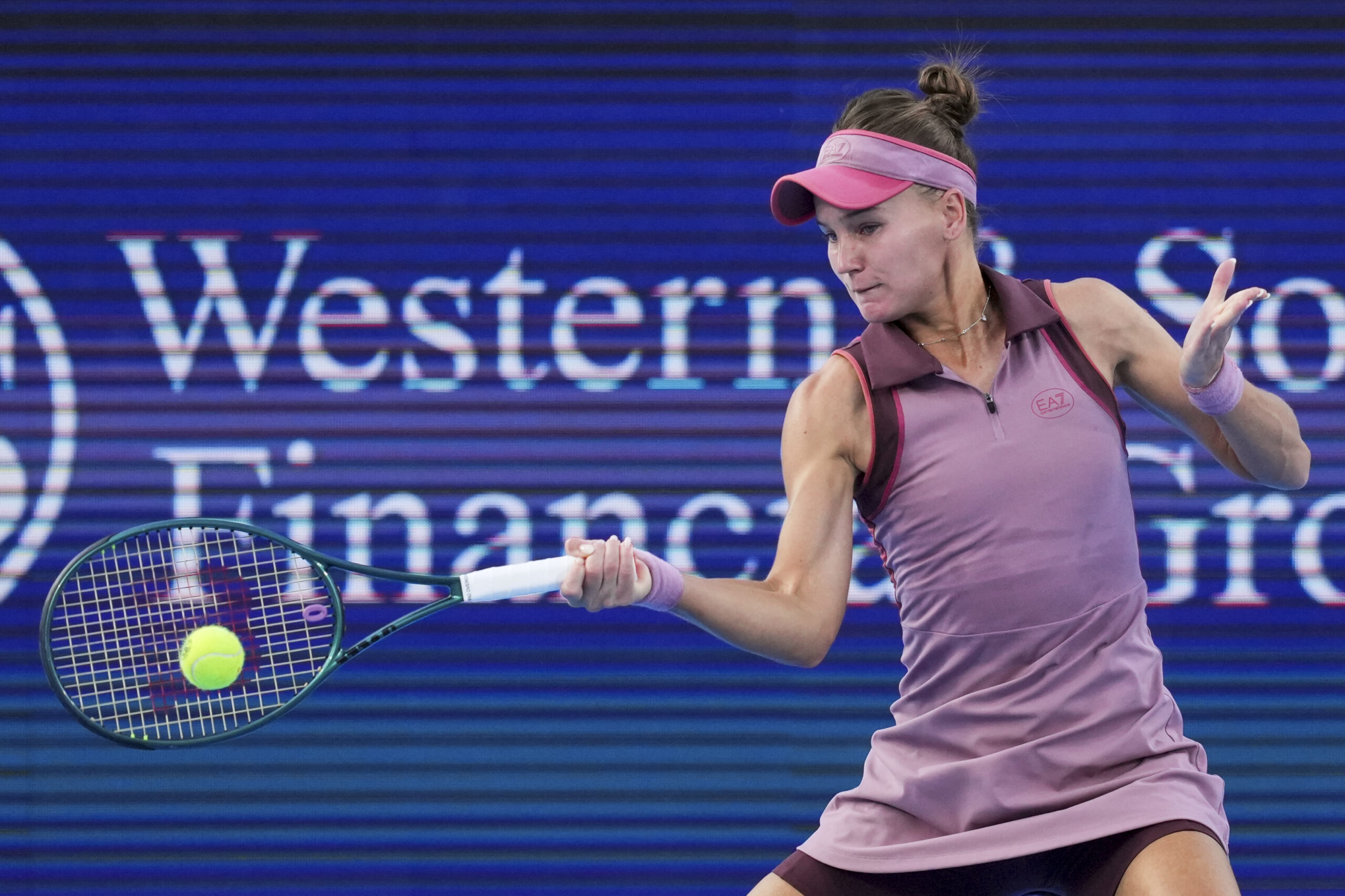 Aug 14, 2025; Cincinnati, OH, USA;  Veronika Kudermetova (RUS) returns a shot against Magda Linette (POL) during the Cincinnati Open at the Lindner Family Tennis Center. Mandatory Credit: Aaron Doster-Imagn Images