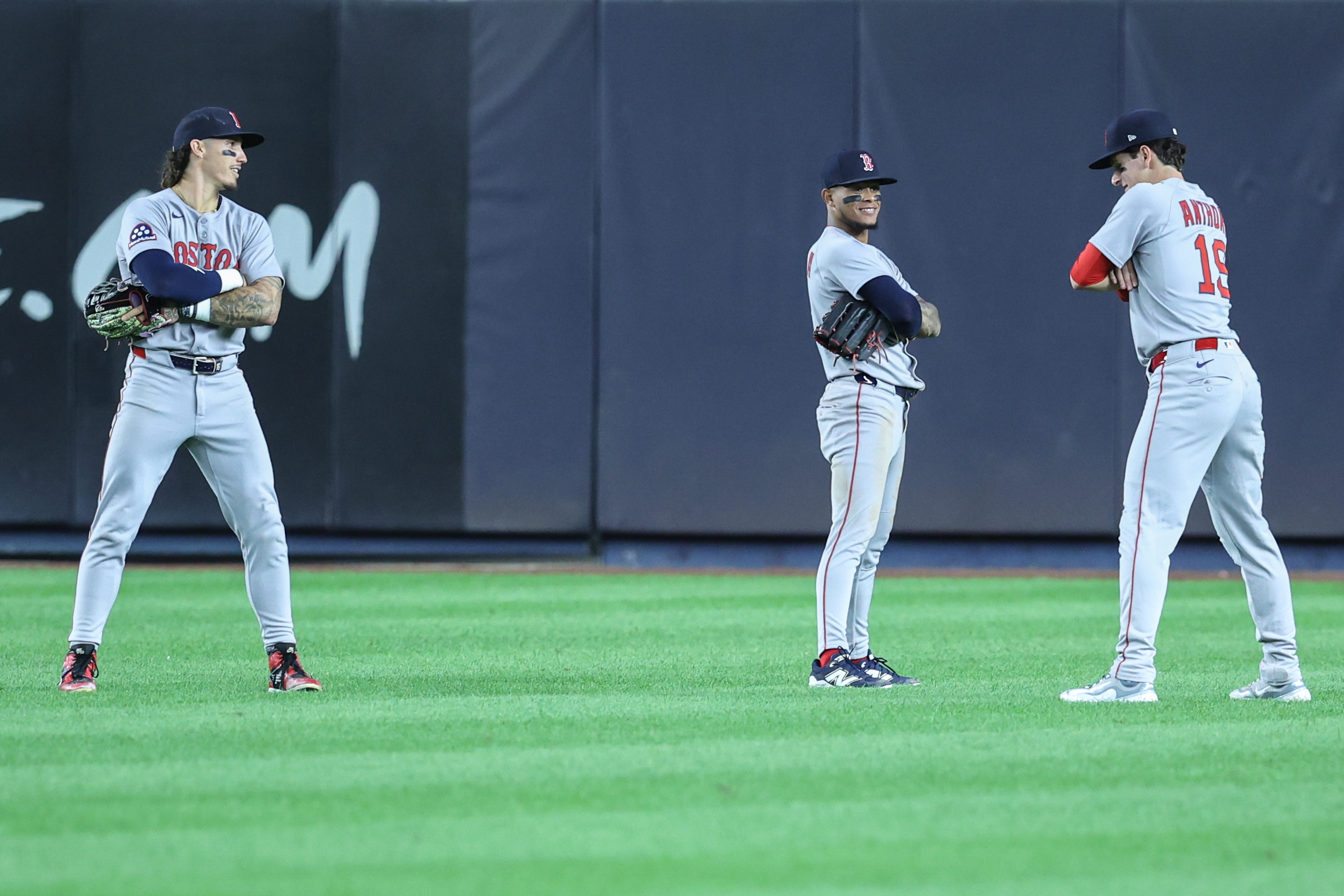 Aug 21, 2025; Bronx, New York, USA;  Boston Red Sox left fielder Jarren Duran (16), center fielder Ceddanne Rafaela (3) and right fielder Roman Anthony (19) pose after defeating the New York Yankees 6-3 at Yankee Stadium. Mandatory Credit: Wendell Cruz-Imagn Images