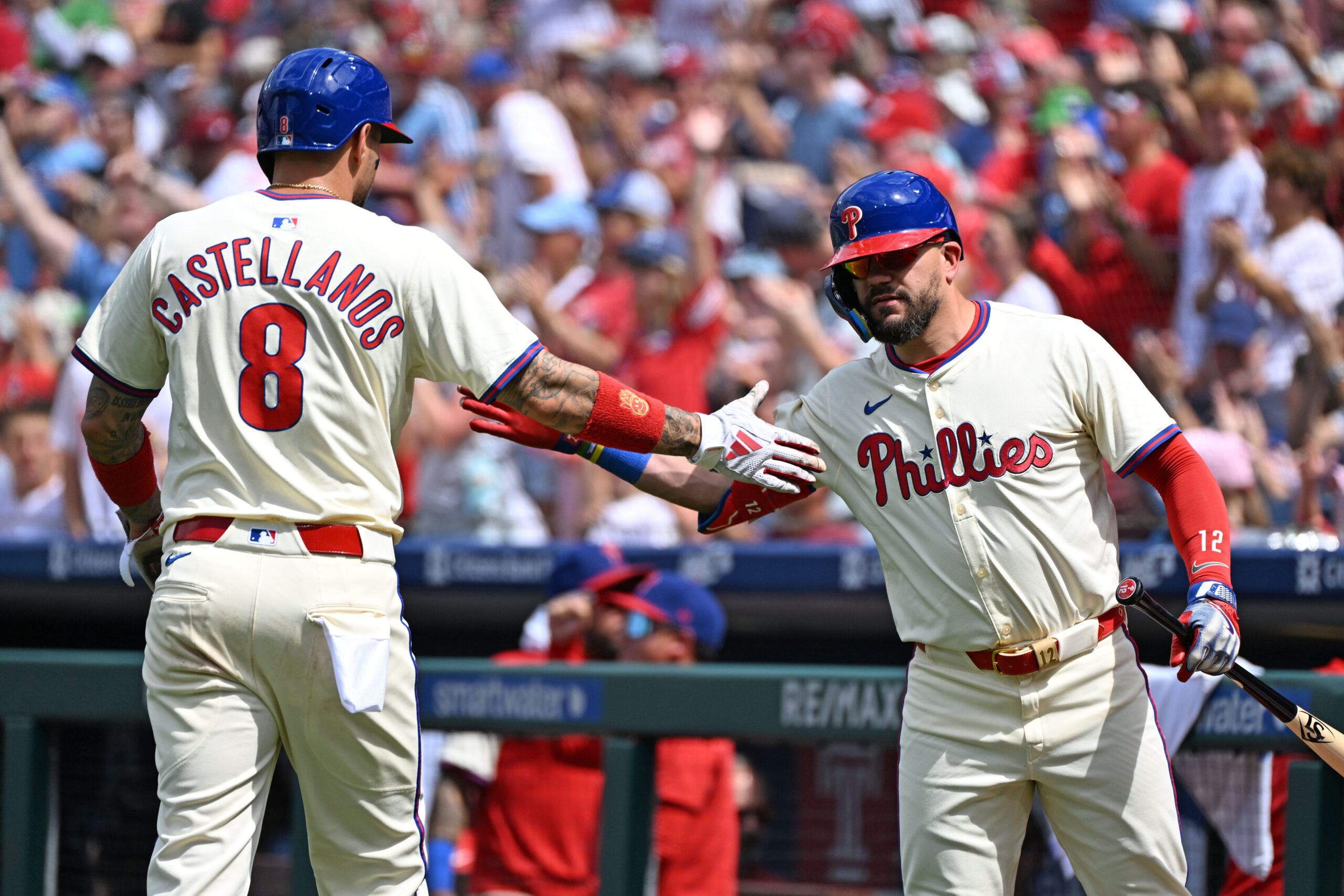 Aug 24, 2025; Philadelphia, Pennsylvania, USA; Philadelphia Phillies outfielder Nick Castellanos (8) celebrates afters scoring a run with outfielder Kyle Schwarber (12) during the second inning against the Washington Nationals at Citizens Bank Park. Mandatory Credit: Eric Hartline-Imagn Images