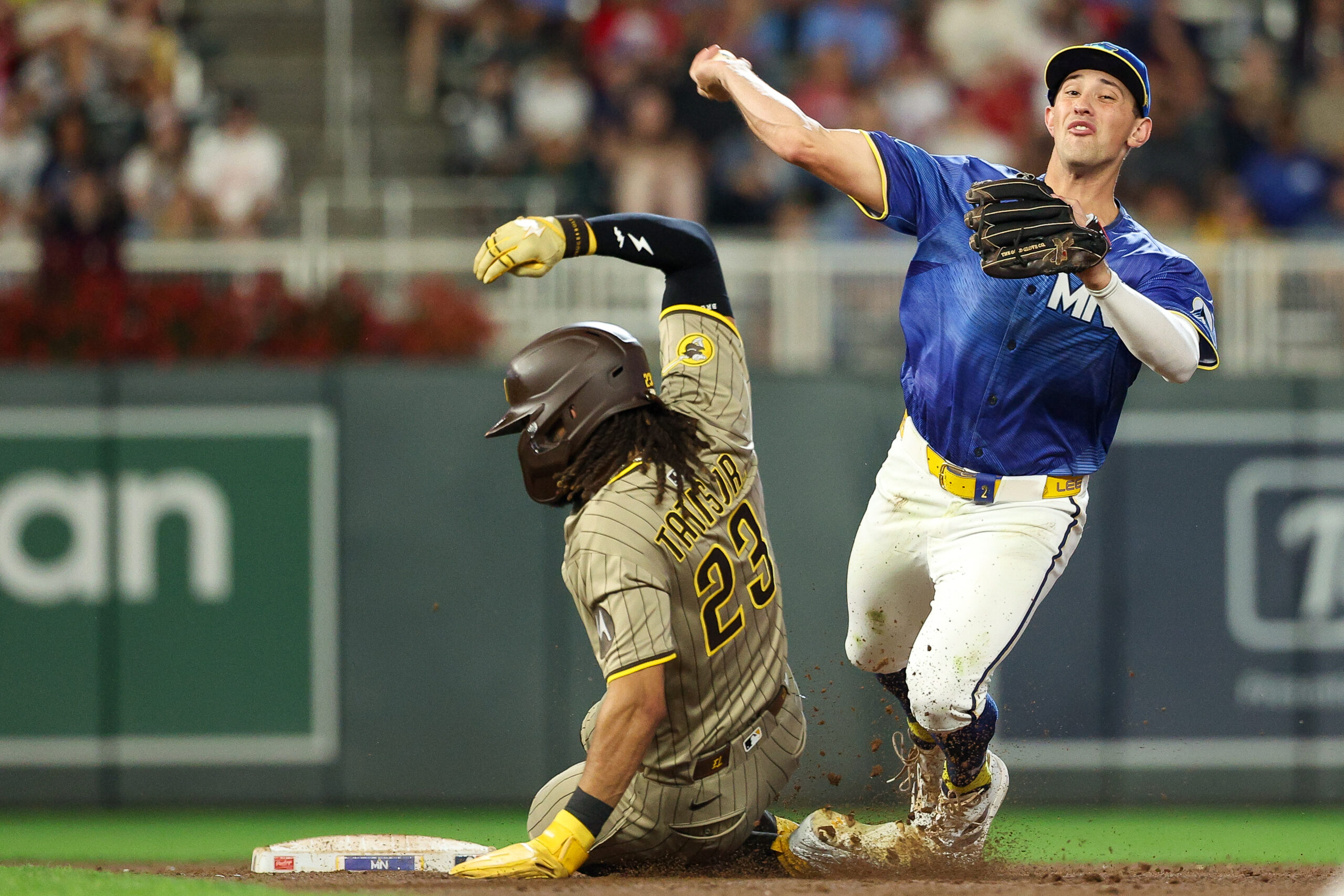 Aug 29, 2025; Minneapolis, Minnesota, USA; Minnesota Twins shortstop Brooks Lee (2) forces out San Diego Padres right fielder Fernando Tatis Jr. (23) at second base on a double play during the fifth inning at Target Field. Mandatory Credit: Matt Krohn-Imagn Images