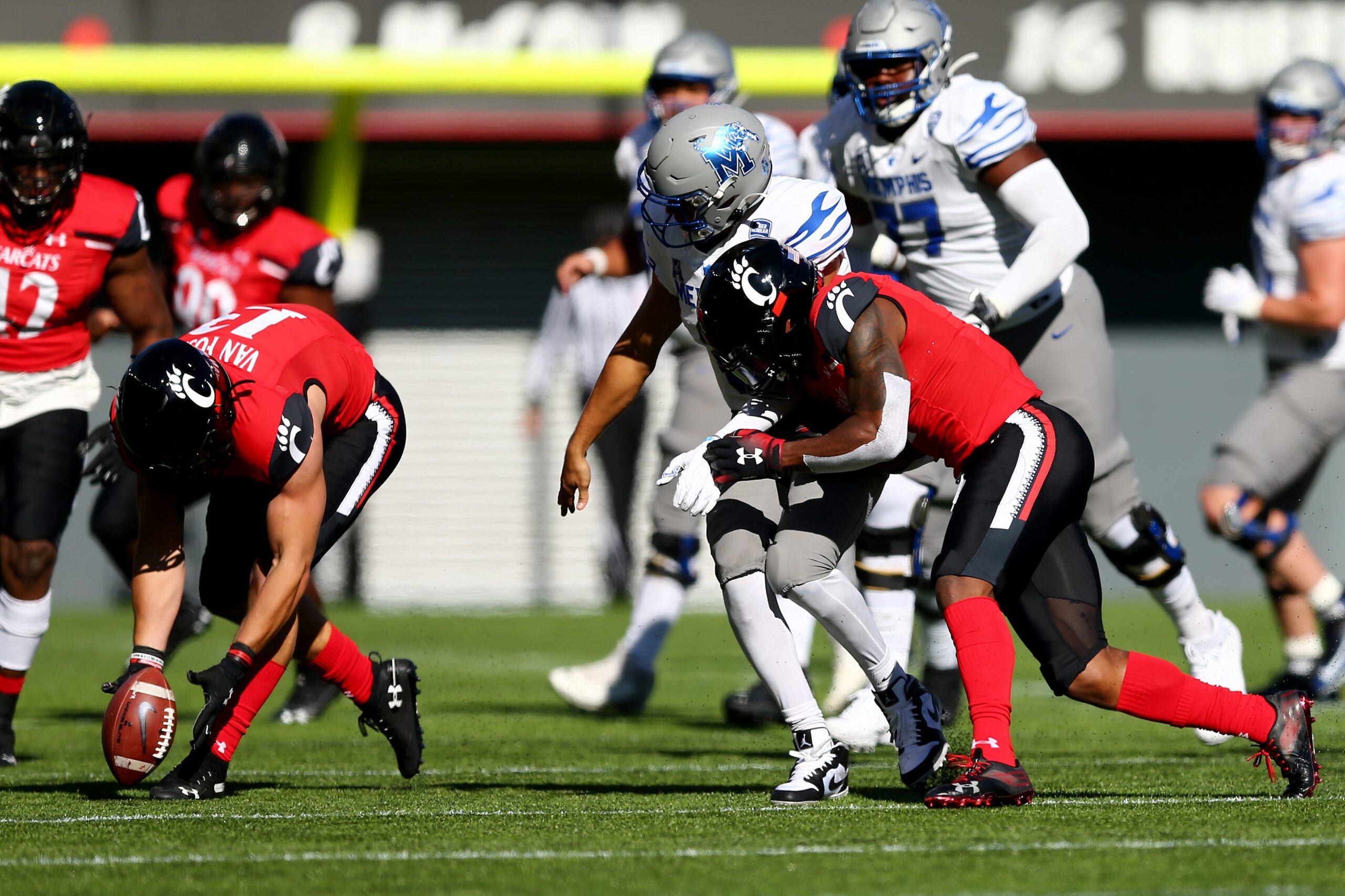 Cincinnati Bearcats linebacker Ty Van Fossen (13), left, collects a forced fumble during the fourth quarter of a college football game against the Memphis Tigers, Saturday, Oct. 31, 2020, at Nippert Stadium in Cincinnati. The Cincinnati Bearcats won 49-10.
Memphis Tigers At Cincinnati Bearcats Oct 31
