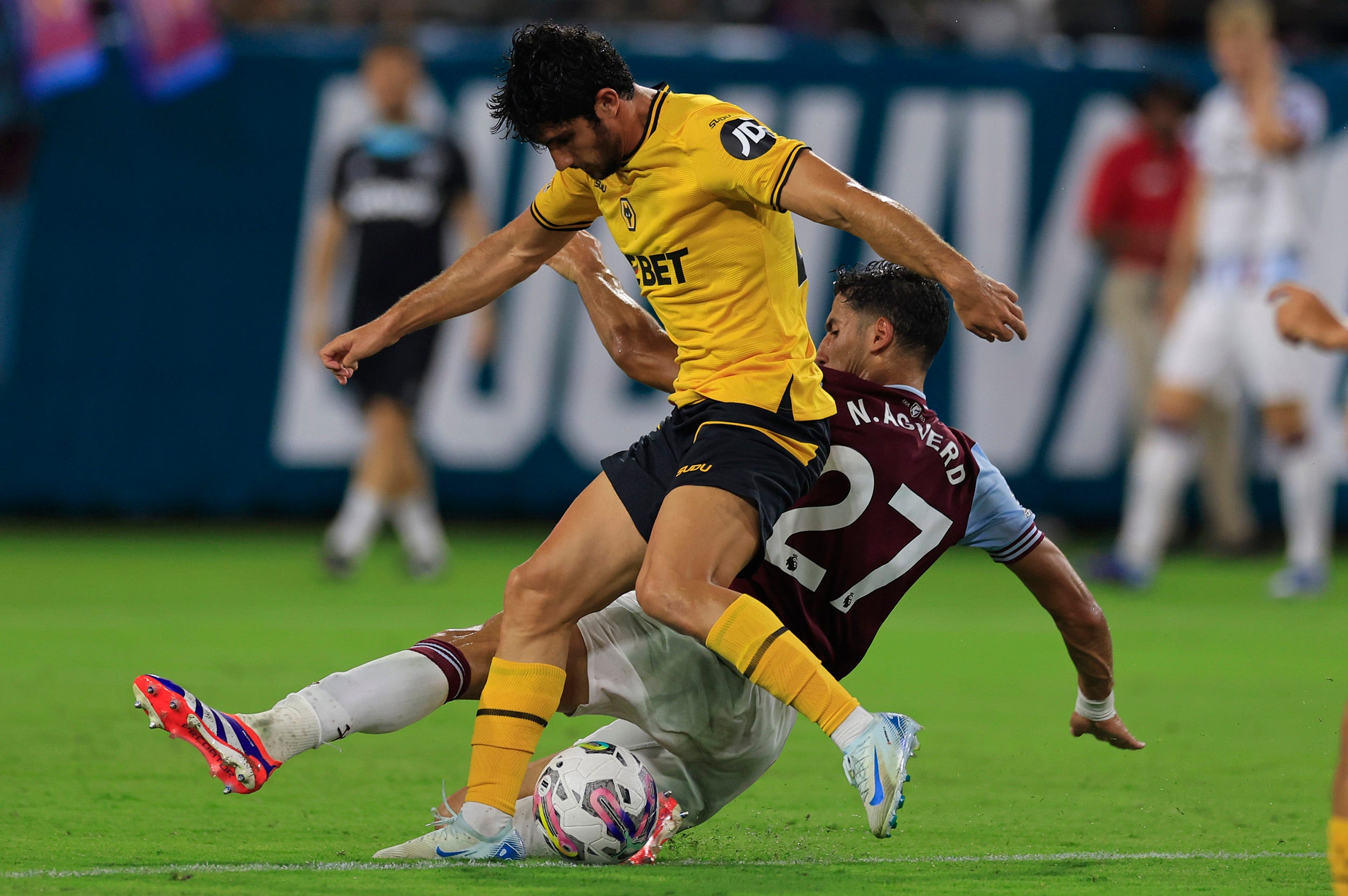 West Ham United defender Nayef Aguerd (27) trips up Wolverhampton Wanderers forward Goncalo Guedes (29) during the second half of The Stateside Cup soccer tournament game Saturday, July 27, 2024 at EverBank Stadium in Jacksonville, Fla. The Wolverhampton Wanderers defeated West Ham United 3-1 in exhibition play.