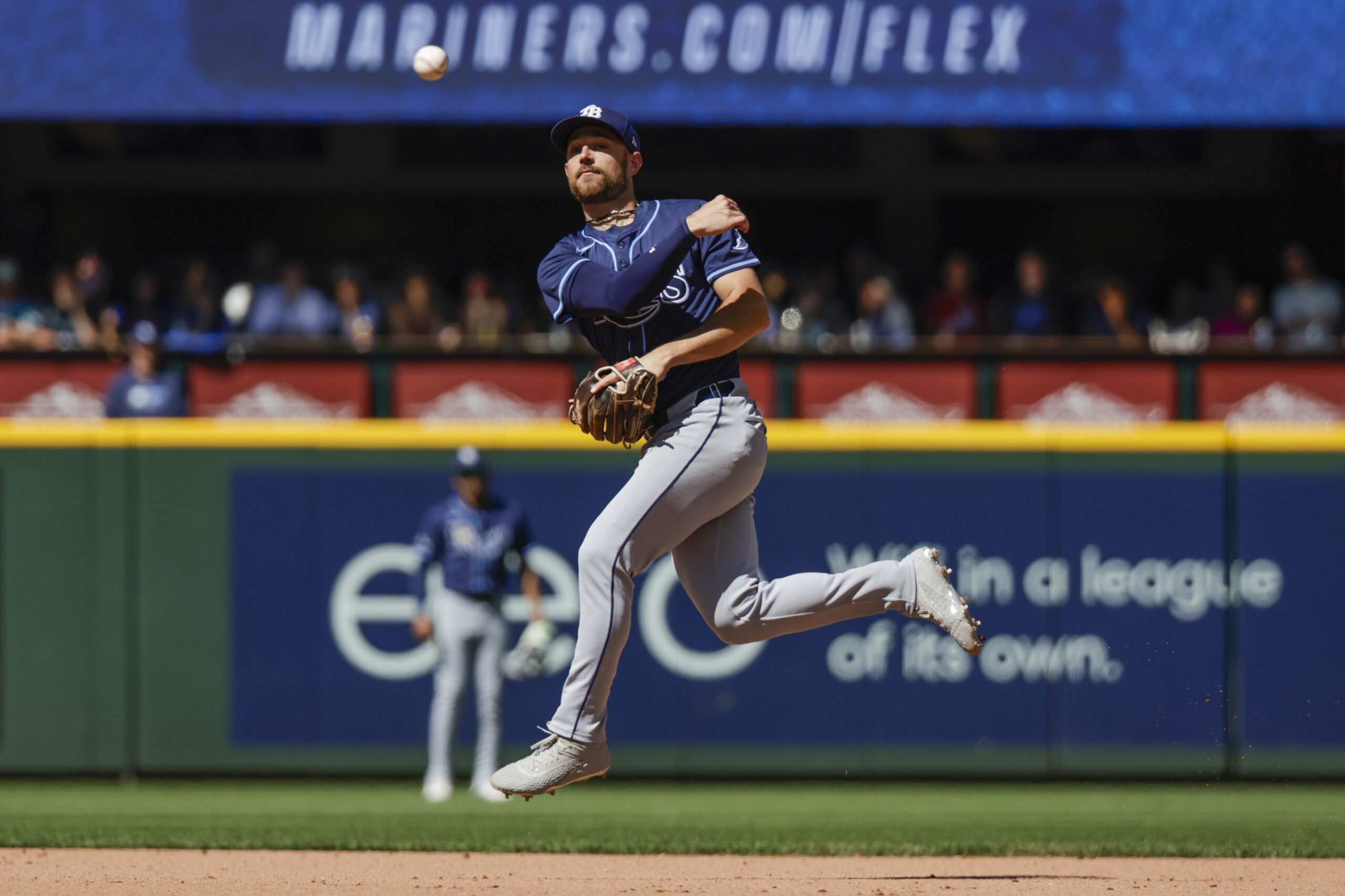 Aug 10, 2025; Seattle, Washington, USA; Tampa Bay Rays second baseman Brandon Lowe (8) throws to first base against the Seattle Mariners during the seventh inning at T-Mobile Park. Mandatory Credit: Joe Nicholson-Imagn Images