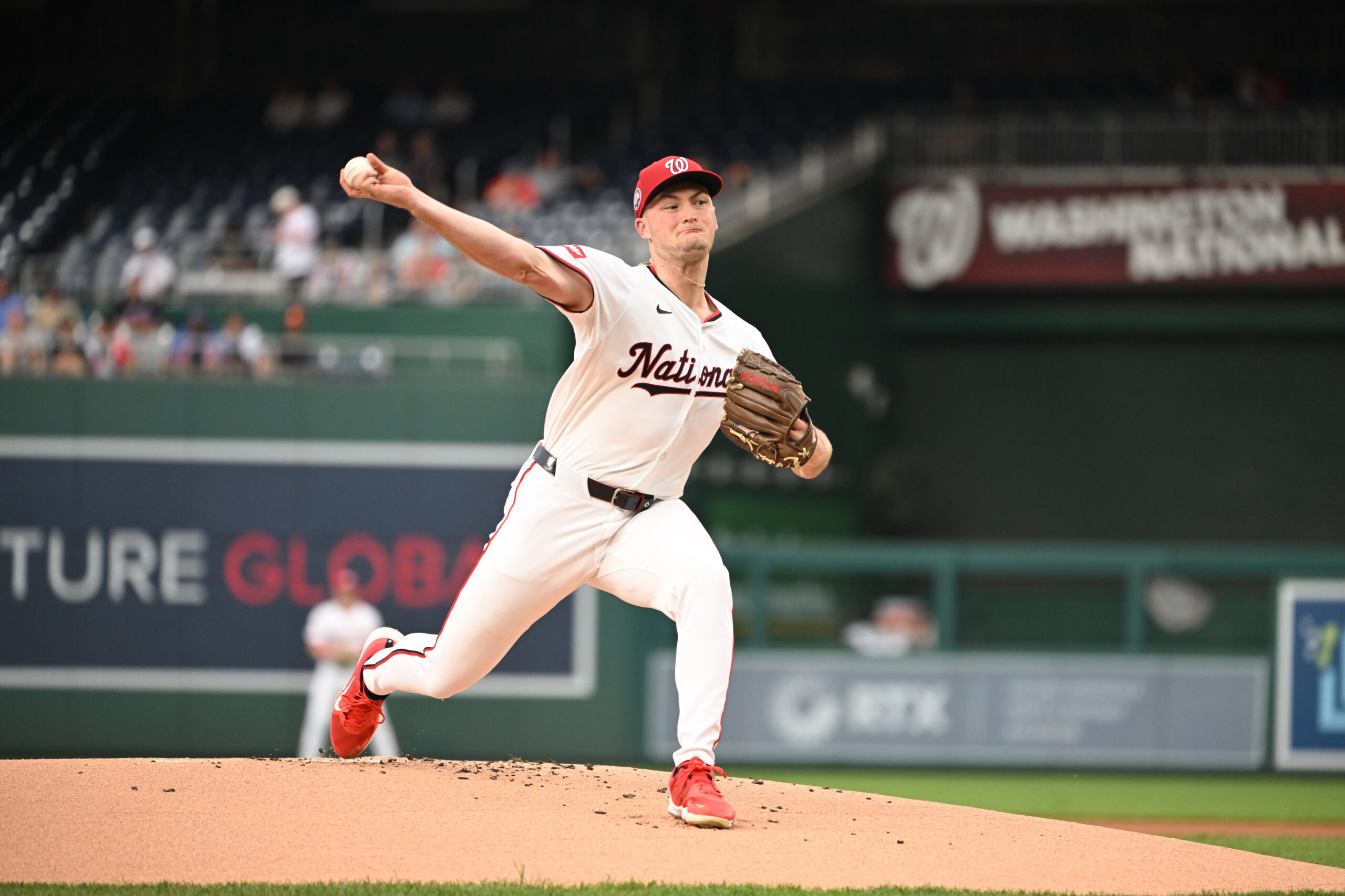 Aug 20, 2025; Washington, District of Columbia, USA; Washington Nationals relief pitcher Brad Lord (61) throws a pitch against the New York Mets during the first inning at Nationals Park. Mandatory Credit: Rafael Suanes-Imagn Images