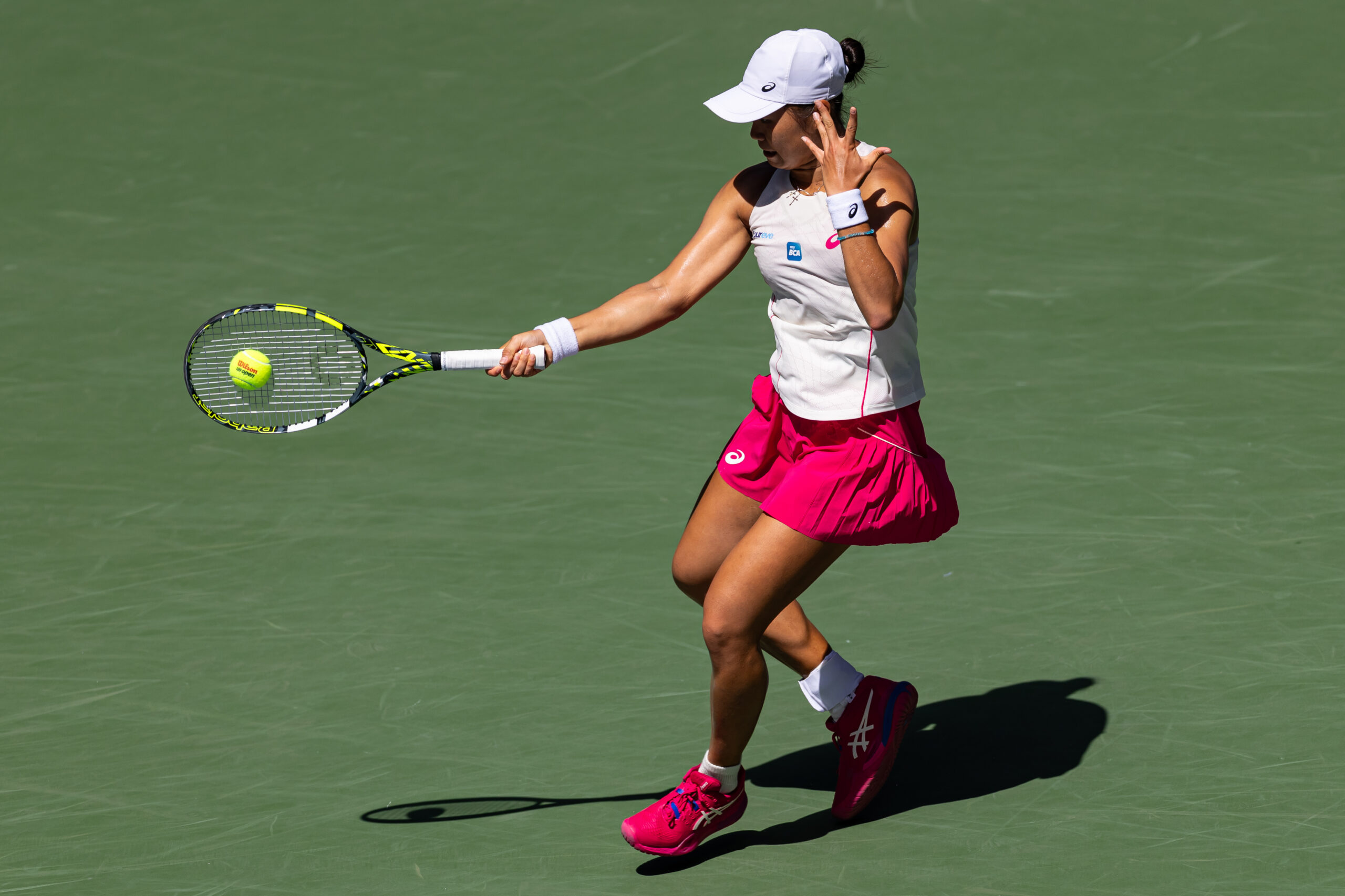 Aug 27, 2025; Flushing, NY, USA; Janice Tjen of Indonesia in action against Emma Raducanu of United Kingdom in the second round of the womenís singles at the US Open at Louis Armstrong Stadium in Billie Jean King National Tennis Center. Mandatory Credit: Mike Frey-Imagn Images