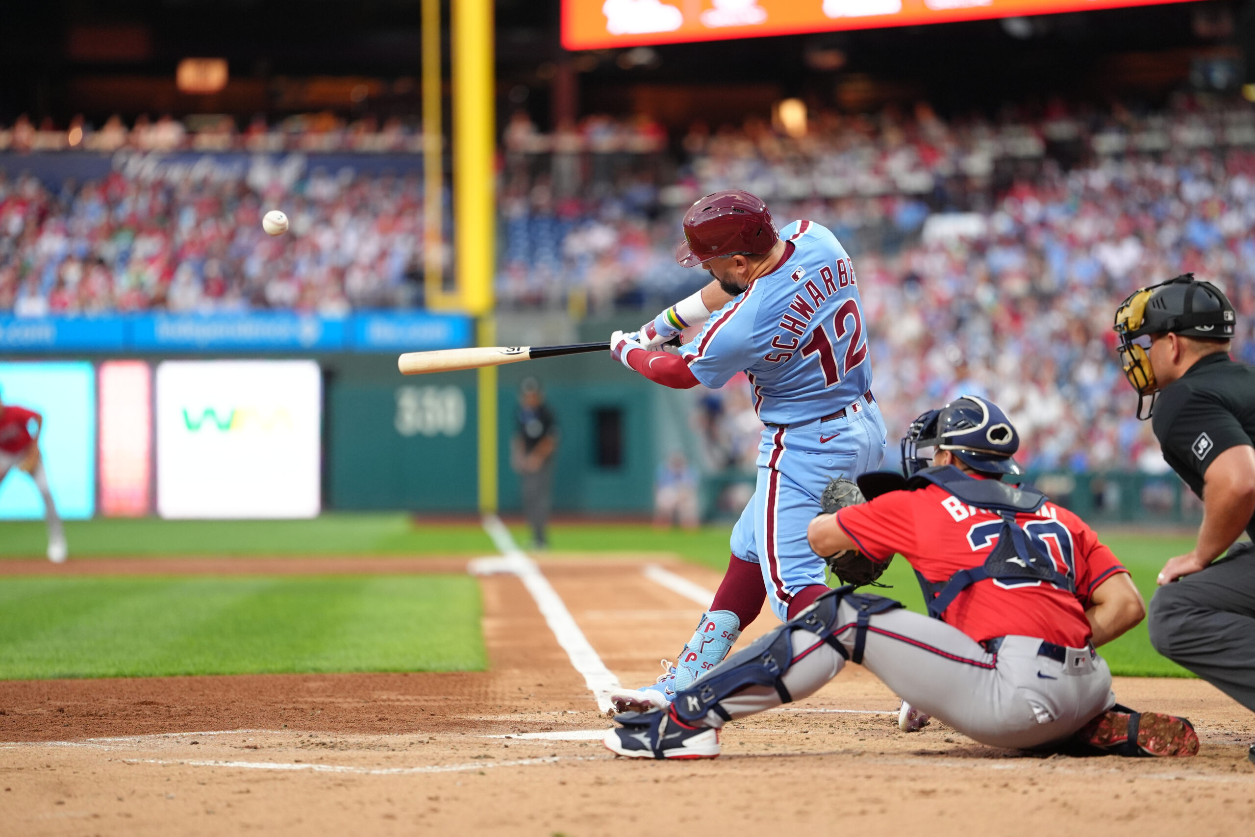 Aug 28, 2025; Philadelphia, Pennsylvania, USA; Philadelphia Phillies designated hitter Kyle Schwarber (12) hits a home run against the Atlanta Braves in the first inning at Citizens Bank Park. Mandatory Credit: Kyle Ross-Imagn Images