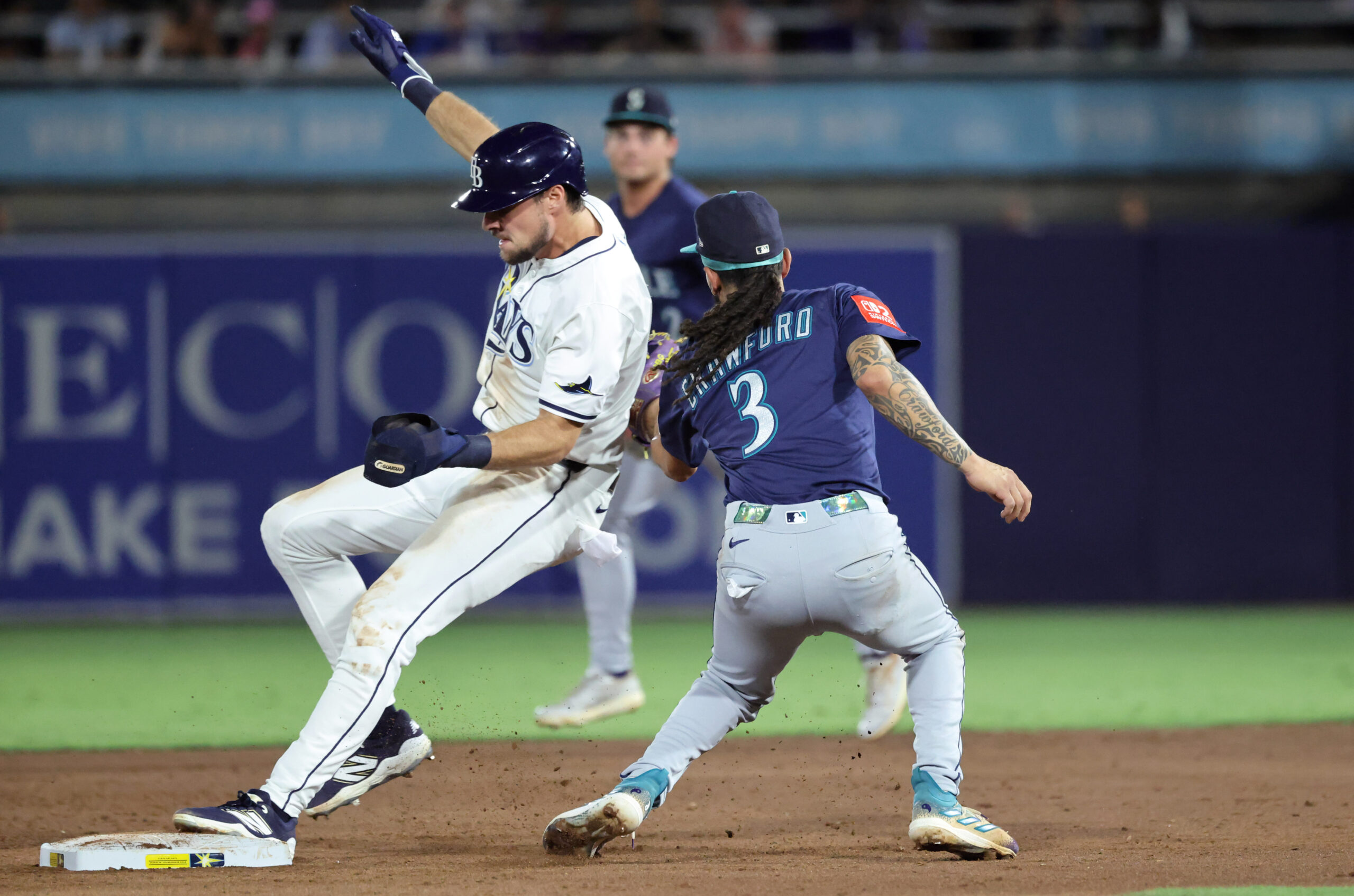 Sep 2, 2025; St. Petersburg, Florida, USA;  Tampa Bay Rays outfielder Josh Lowe (15) steals second base as Seattle Mariners shortstop J.P. Crawford (3) attempted to tag him out during the third inning at George M. Steinbrenner Field. Mandatory Credit: Kim Klement Neitzel-Imagn Images