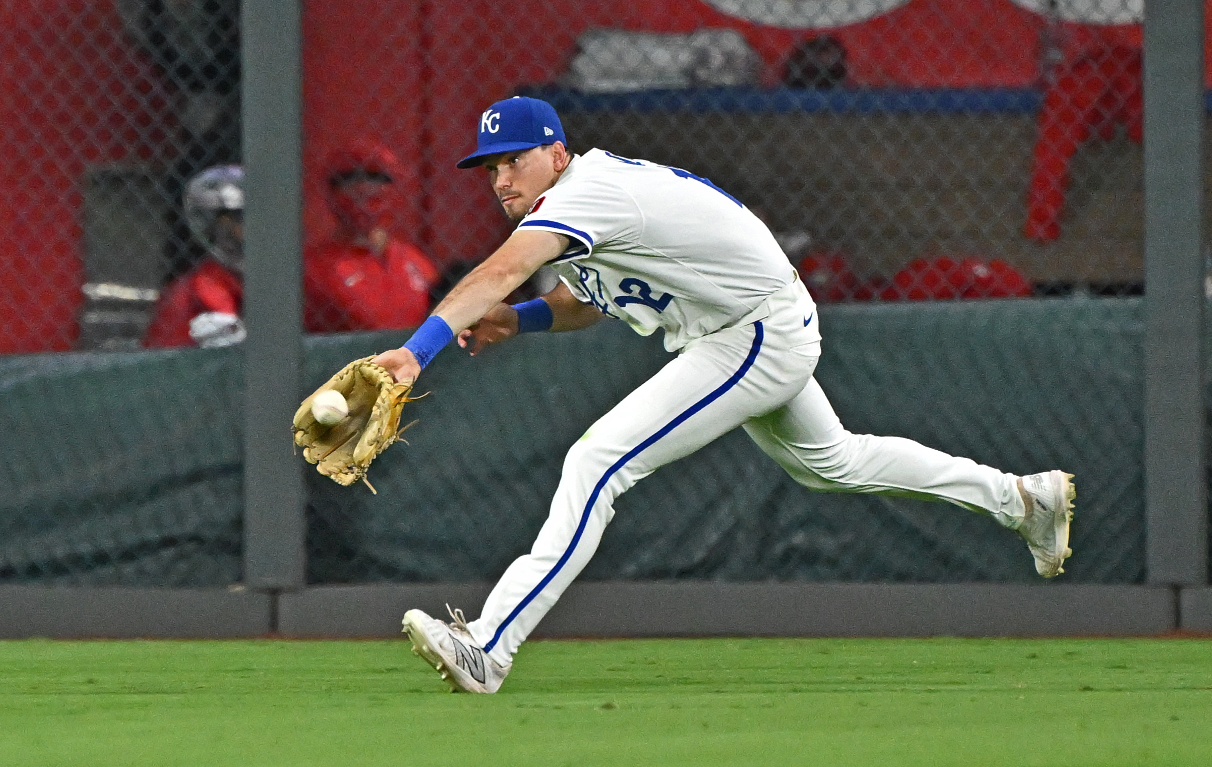 Sep 2, 2025; Kansas City, Missouri, USA;  Kansas City Royals left fielder Nick Loftin (12) makes a running catch in the ninth inning against the Los Angeles Angels at Kauffman Stadium. Mandatory Credit: Peter Aiken-Imagn Images